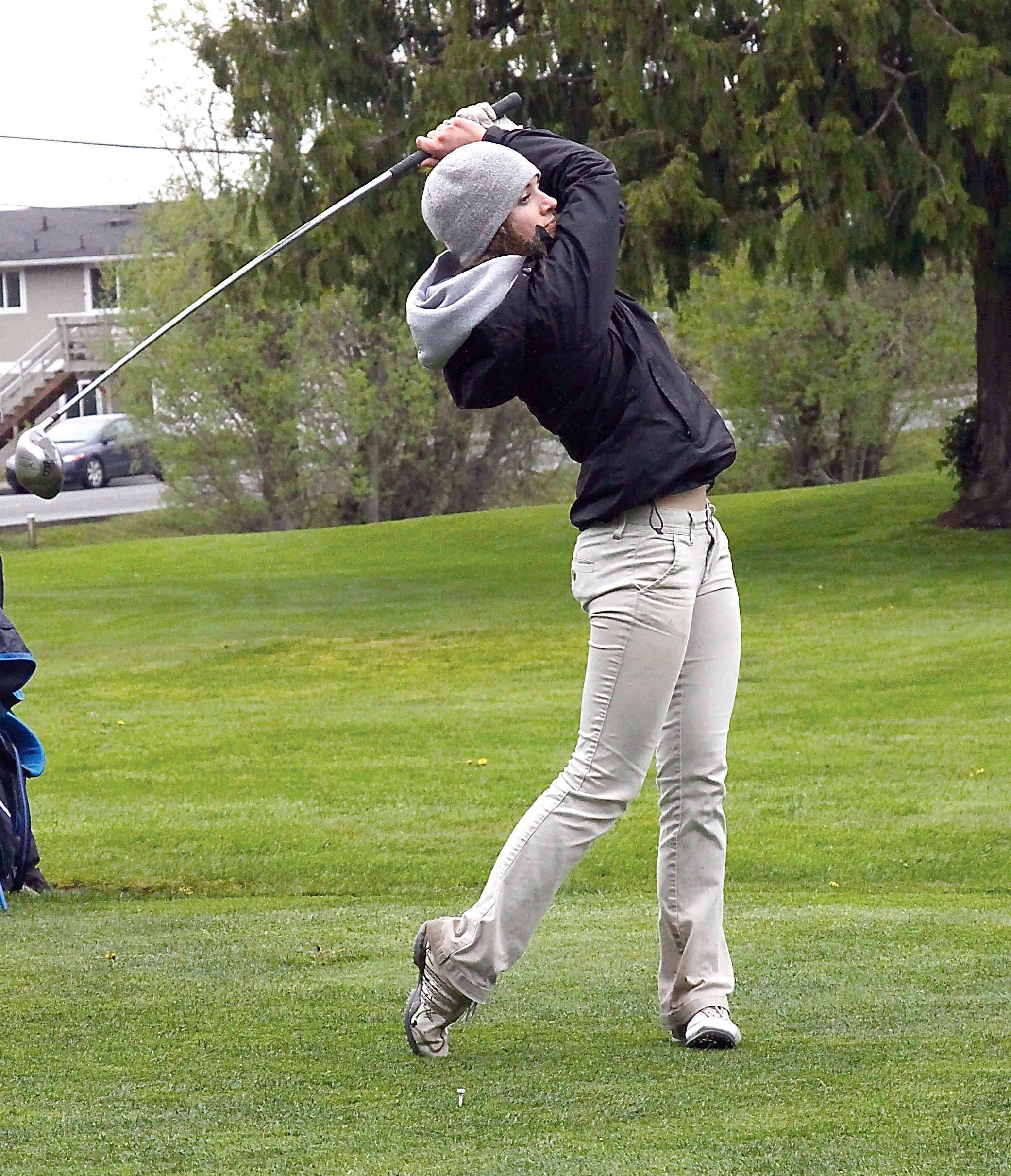 Kate Haworth of Port Angeles hits her tee shot off the 18th tee during the Roughriders match against Olympic at Peninsula Golf Club. (Dave Logan/for Peninsula Daily News)