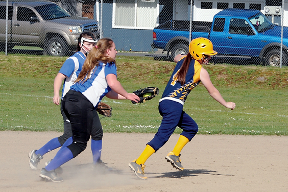 Chimacum shortstop Shanya Nisbet runs down Forks' Skyler DeMatties at second base. DeMatties was tagged out