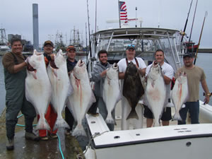 A file photo from Washington Department of Fish and Wildlife of happy halibut fishermen. ()