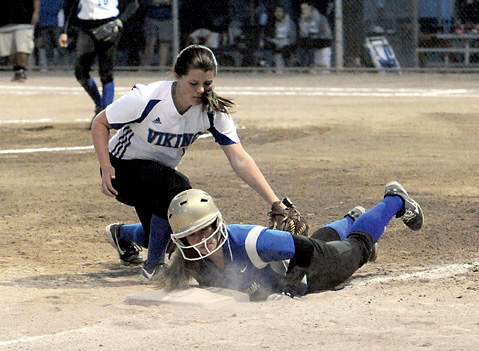 Chimacum's Mechelle Nisbet slides safely back to third under the tag of Bellevue Christian's Annie Whitton. (Lonnie Archibald/for Peninsula Daily News)