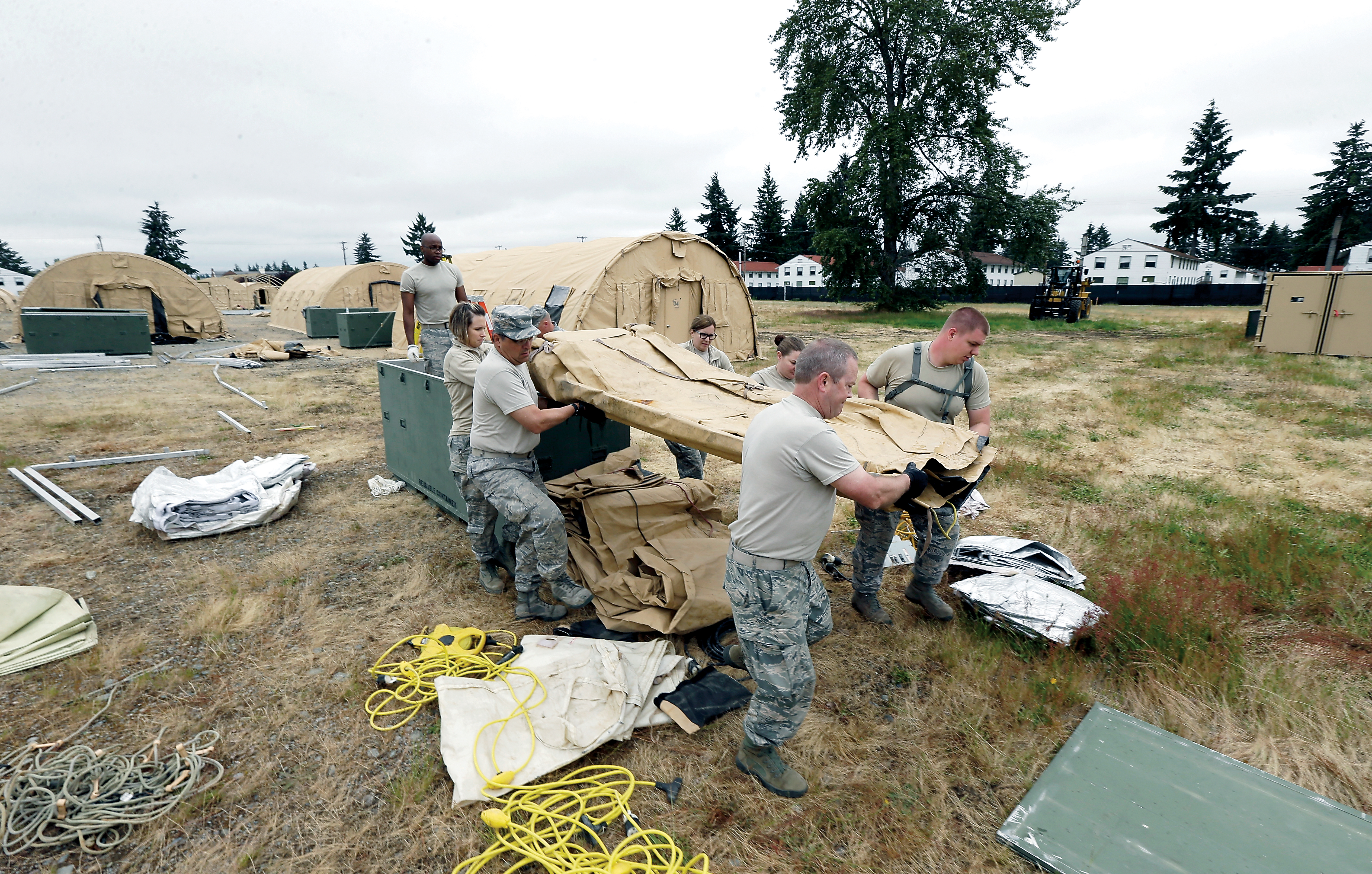 Washington Air National Guard soldiers from Fairchild Air Force Base in Spokane work to assemble temporary living structures at Joint Base Lewis-McChord. During the second week of June emergency responders in the Pacific Northwest will conduct drills to test how ready they are to respond to a massive earthquake and tsunami. The June 7-10 exercise is called Cascadia Rising. It is named after the Cascadia Subduction Zone