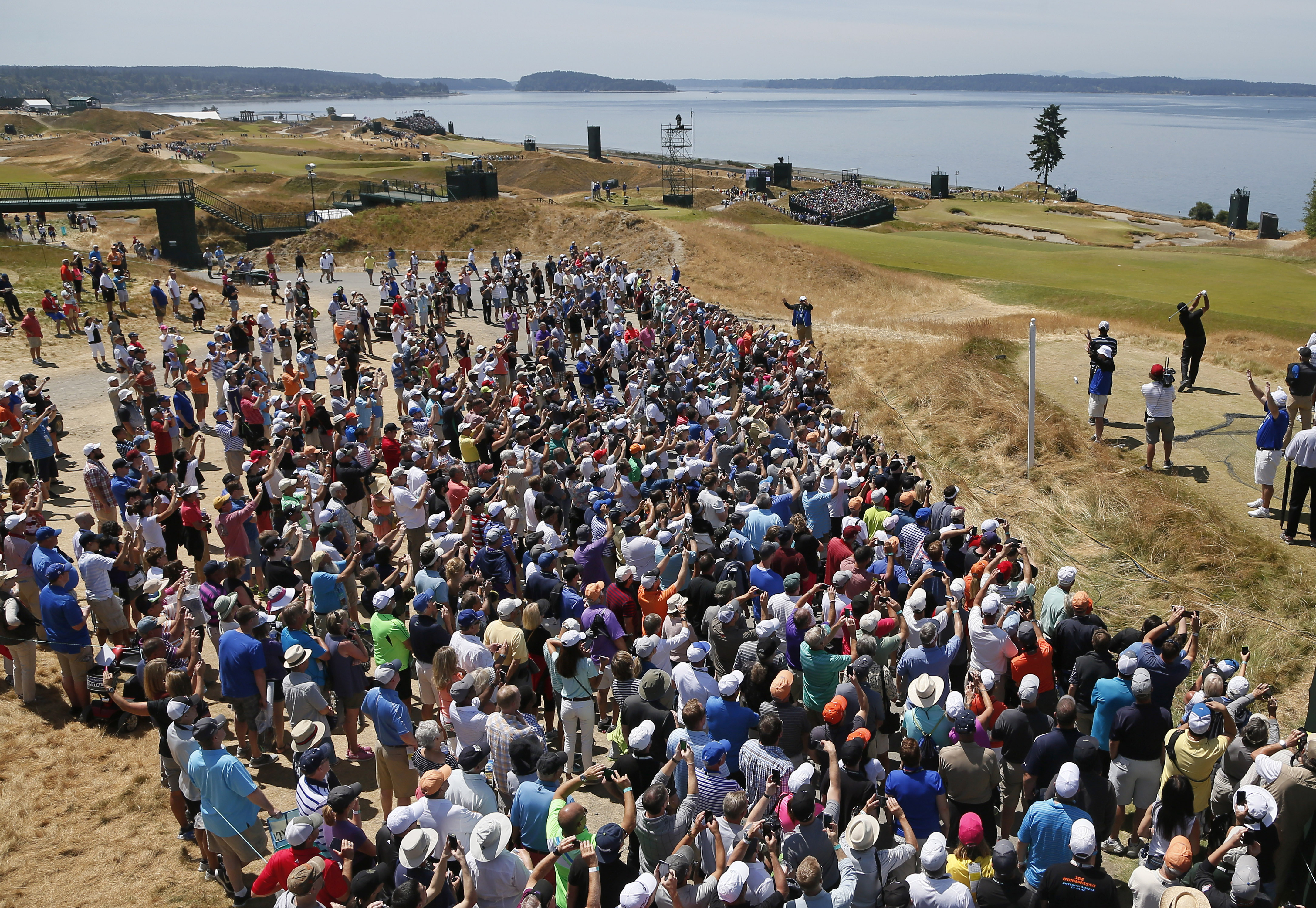 A herd of fans watches Phil Mickelson