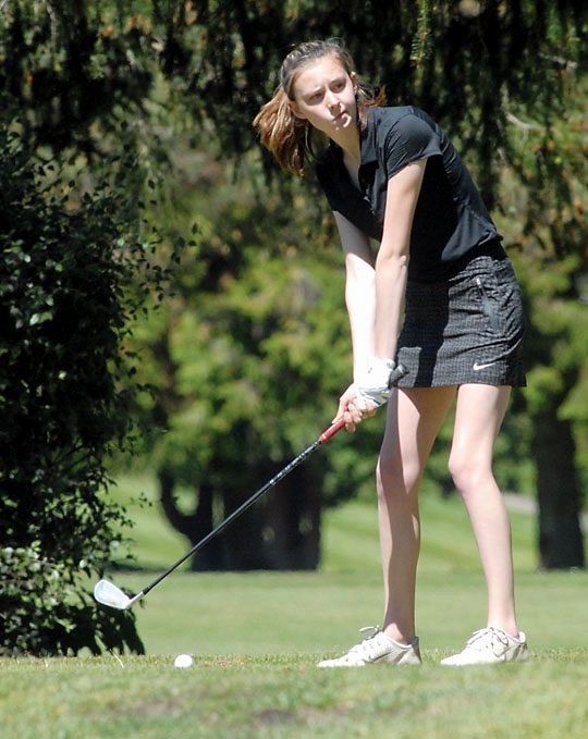 Alex McMenamin of Sequim looks toward the fairway during a match in May at the Cedars at Dungeness golf course. McMenamin is the All-Peninsula Girls Golf MVP for the third-straight season. (Keith Thorpe/Peninsula Daily News)