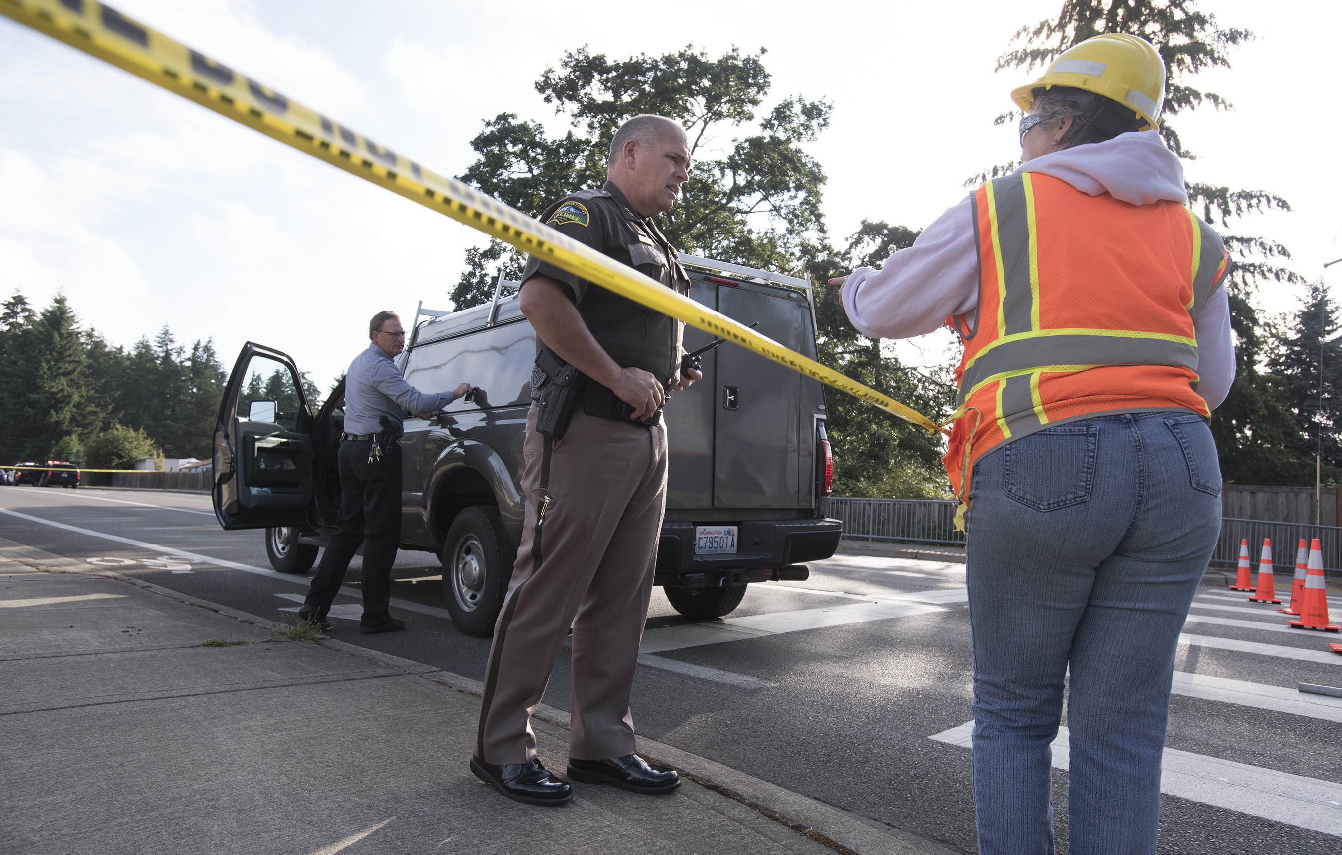 Thurston County sheriff's detectives investigate an early morning shooting today near Lacey that left three people dead and one injured