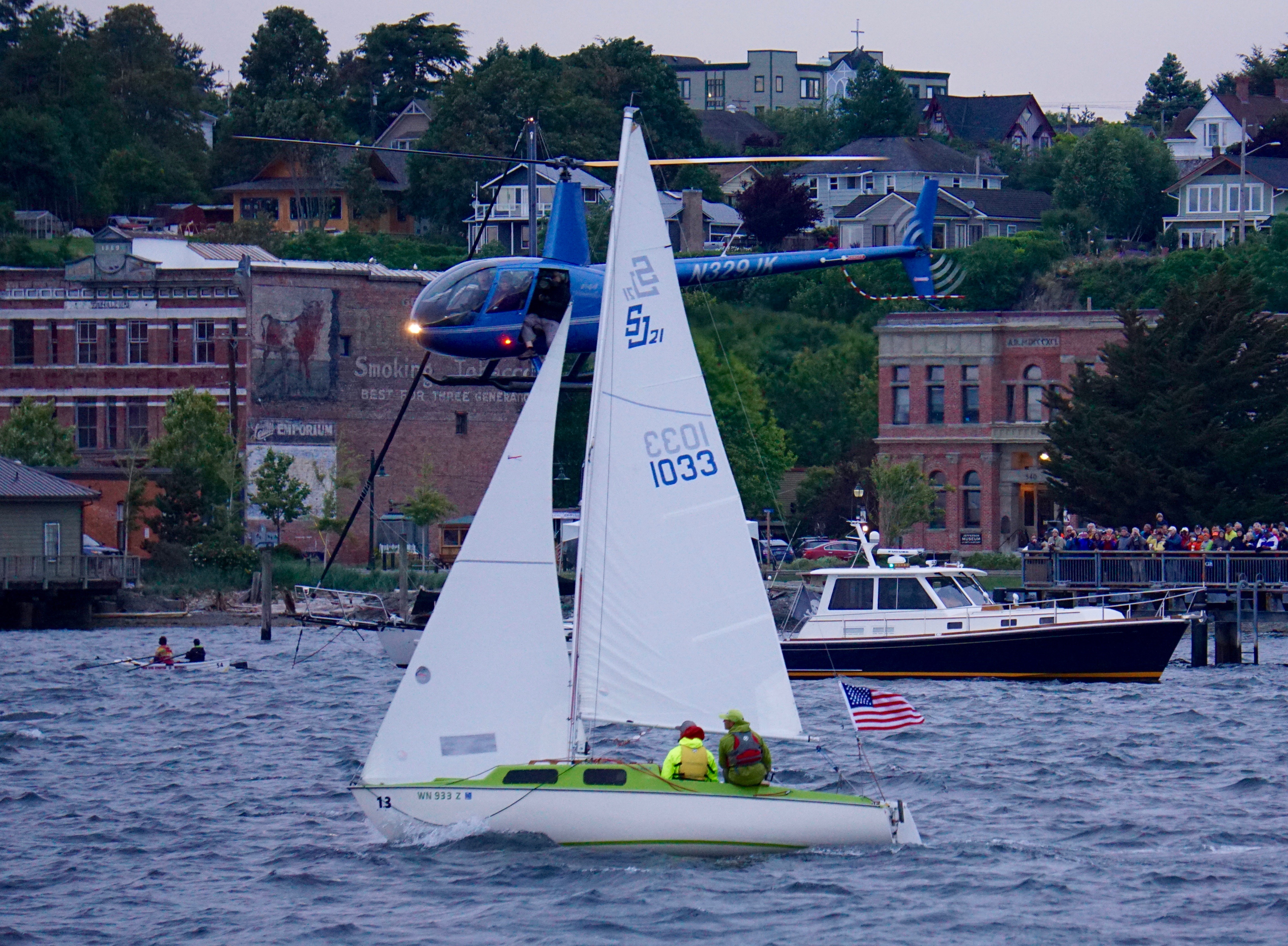 The Port Townsend Police Department is considering filing reckless endangerment charges against a helicopter that flew too low over Port Townsend at the beginning of Thursday's Race to Alaska. (Charlie Bermant/Peninsula Daily News)