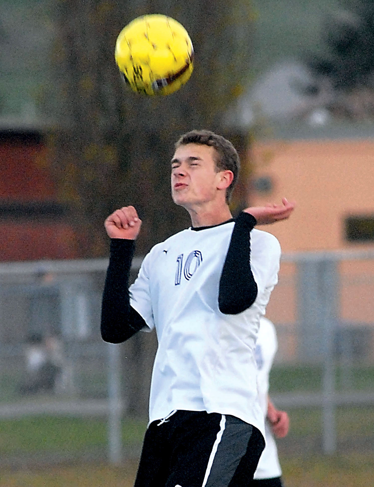 Sequim midfielder Eli Berg heads the ball during the Wolves' 3-2 victory over rival Port Angeles this season. Keith Thorpe/Peninsula Daily News