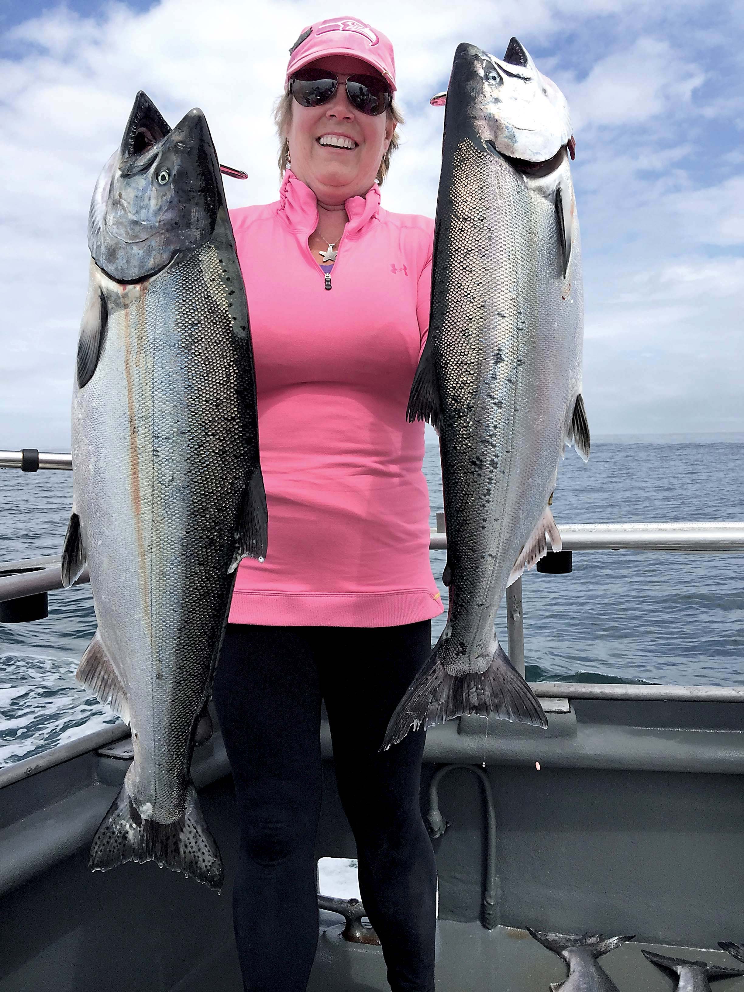 Brenda Kay Burke of Port Townsend caught these two good-sized chinook while fishing off the Garbage Dump near Neah Bay on Monday. ()