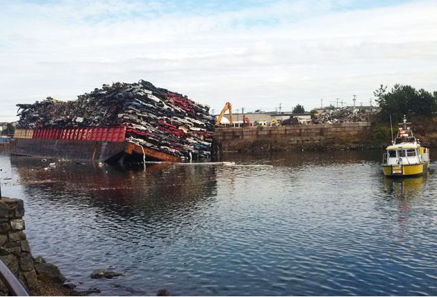 The barge after it tipped and dumped vehicles into Victoria harbor. British Columbia Ministry of Environment via AP