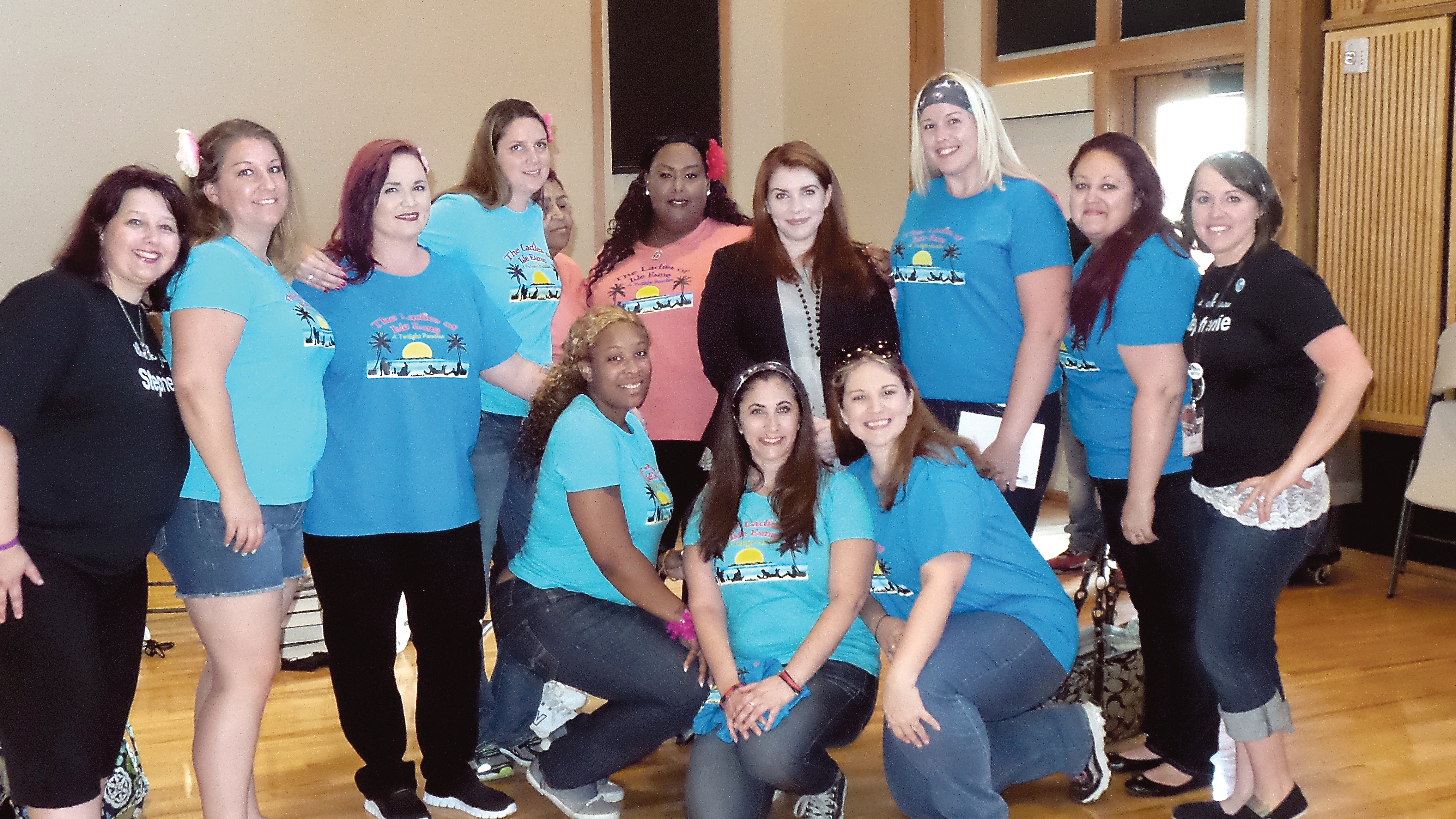 Members of “The Ladies of Isle Esme” pose with Twilight series author Stephenie Meyer