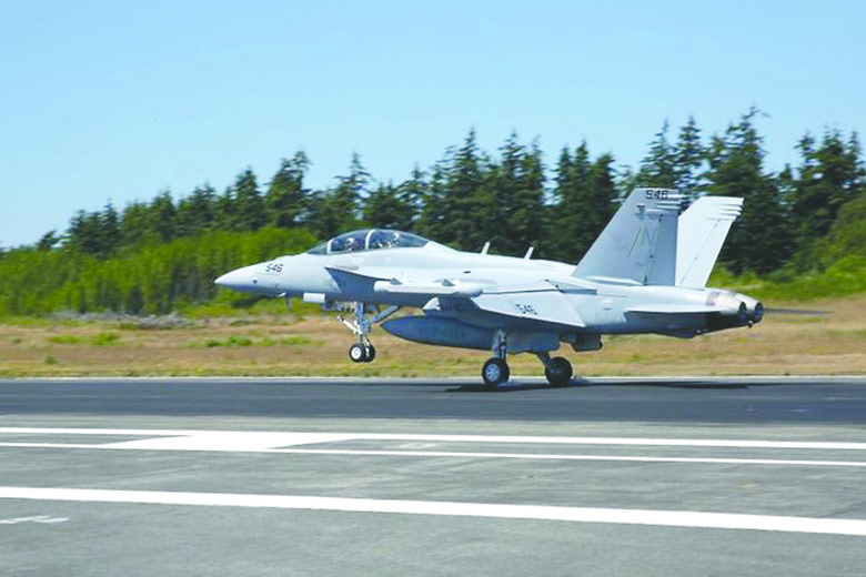 An EA-18G Growler assigned to Electronic Attack Squadron (VAQ) 129 lands on Naval Air Station Whidbey Island's Ault Field. U.S. Navy