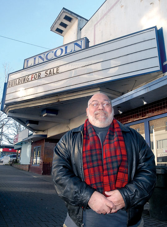 Scott Nagel stands in front of the shuttered Lincoln Theater in downtown Port Angeles last week. (Keith Thorpe/Peninsula Daily News)