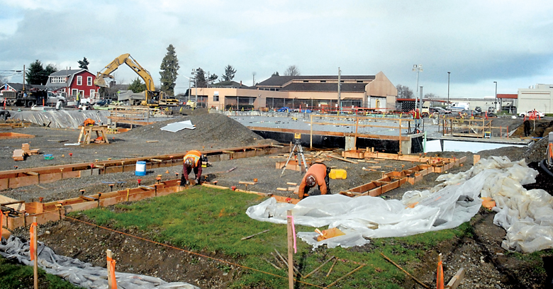 Construction continues on Olympic Medical Center's new medical office building in Port Angeles last week after the project was delayed by the discovery of diesel fuel-tainted soil on the site. (Keith Thorpe/Peninsula Daily News)