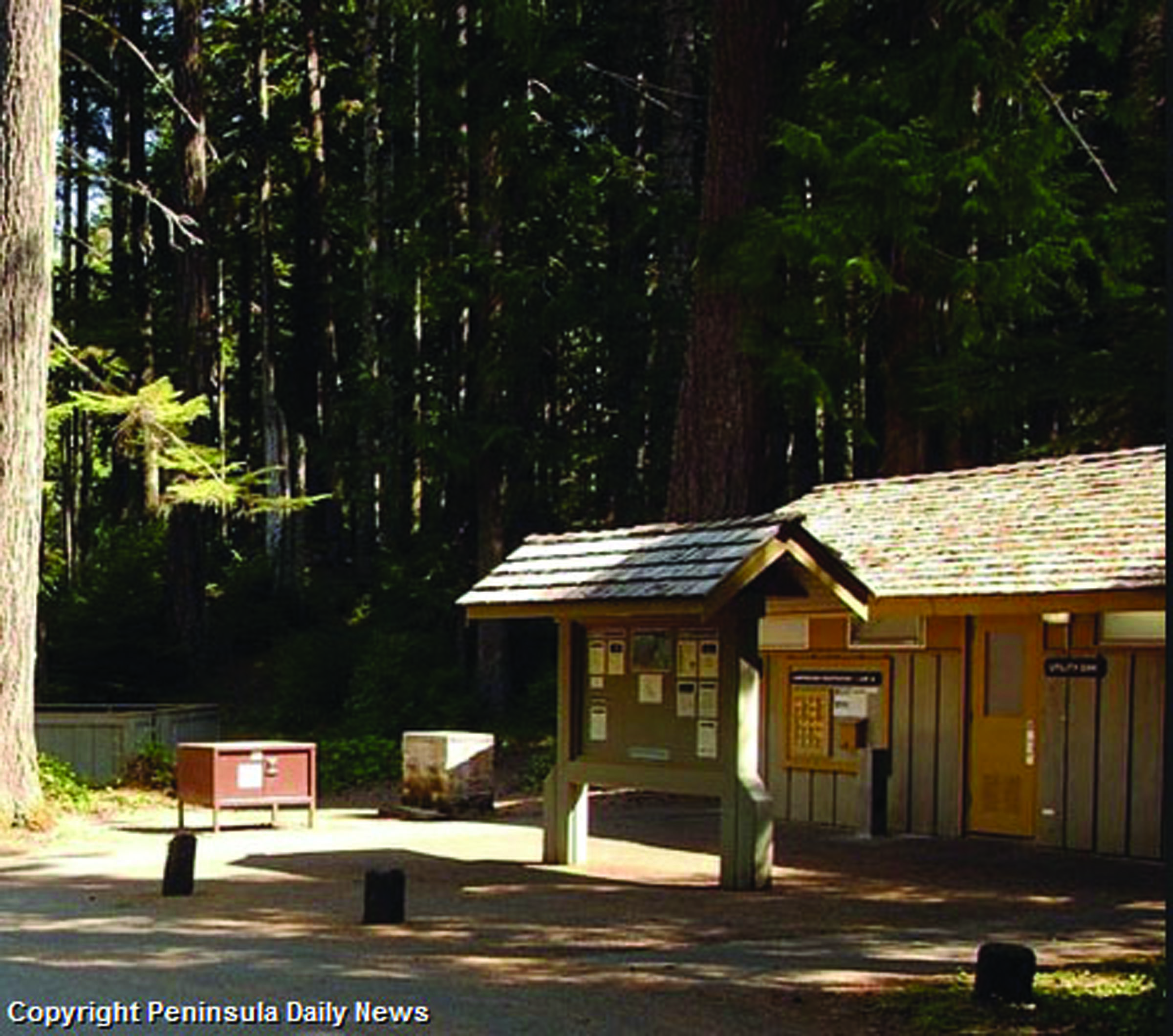 Bulletin board greets visitors to Heart o' the Hills campground. ()