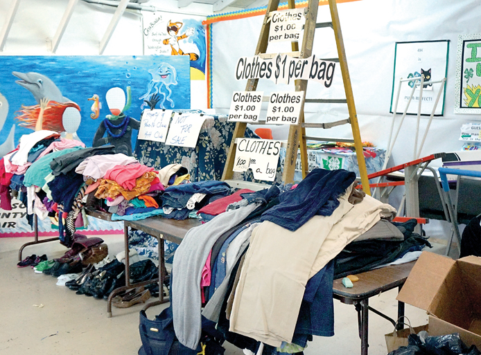 Bargain hunters can purchase a bag of clothes for a dollar at this weekend's Jeffco Community Garage Sale and Flea Market. (Charlie Bermant/Peninsula Daily News)