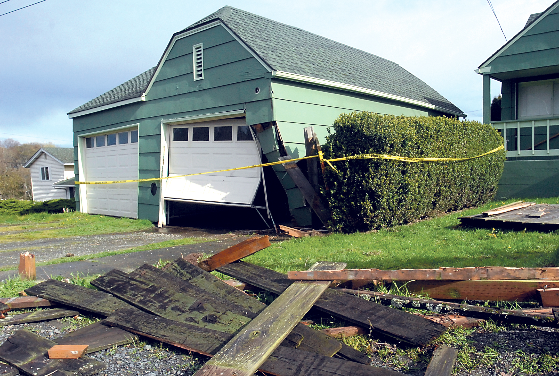 This garage in the 900 block of East Lauridsen Boulevard and a fence