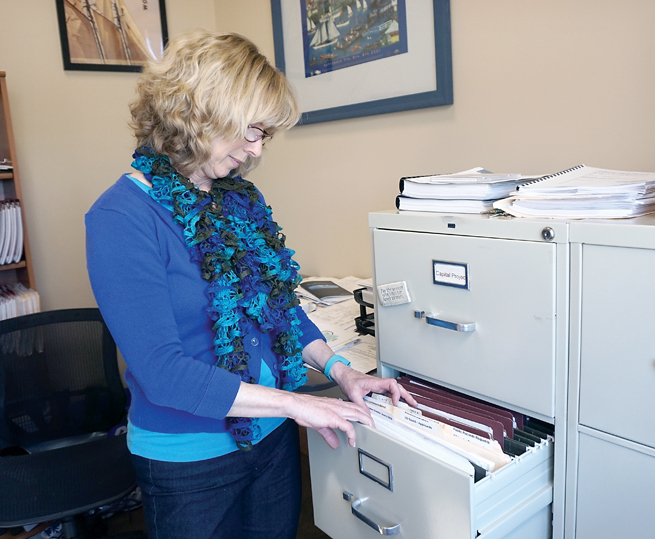 Port of Port Townsend Human Resources Director Abigail Berg takes an inventory of applications for the open port director position. — Charlie Bermant/Peninsula Daily News ()