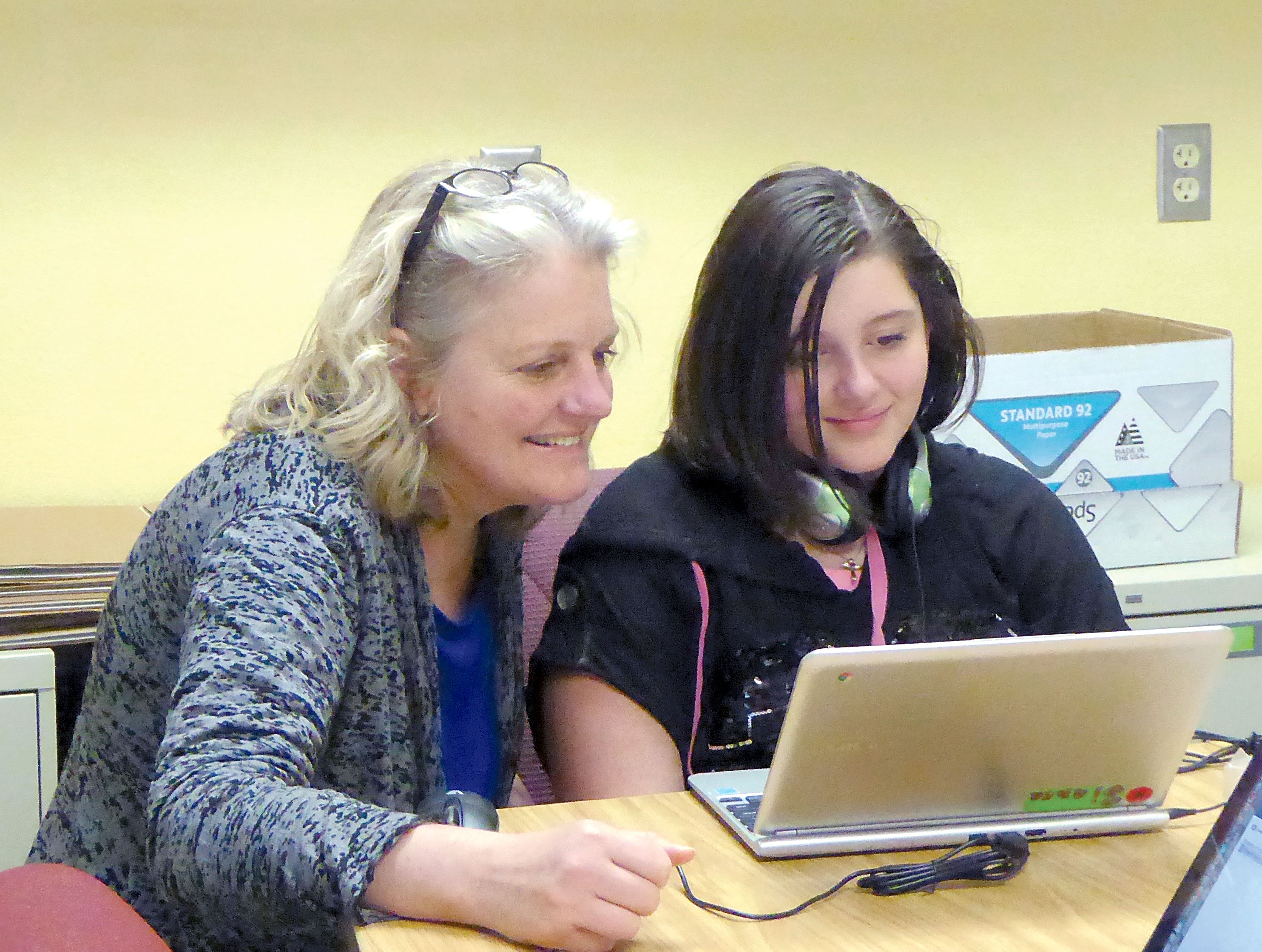 Grant Street Elementary School Principal Mary Sepler administers a test to fifth-grader Bianca Frederick