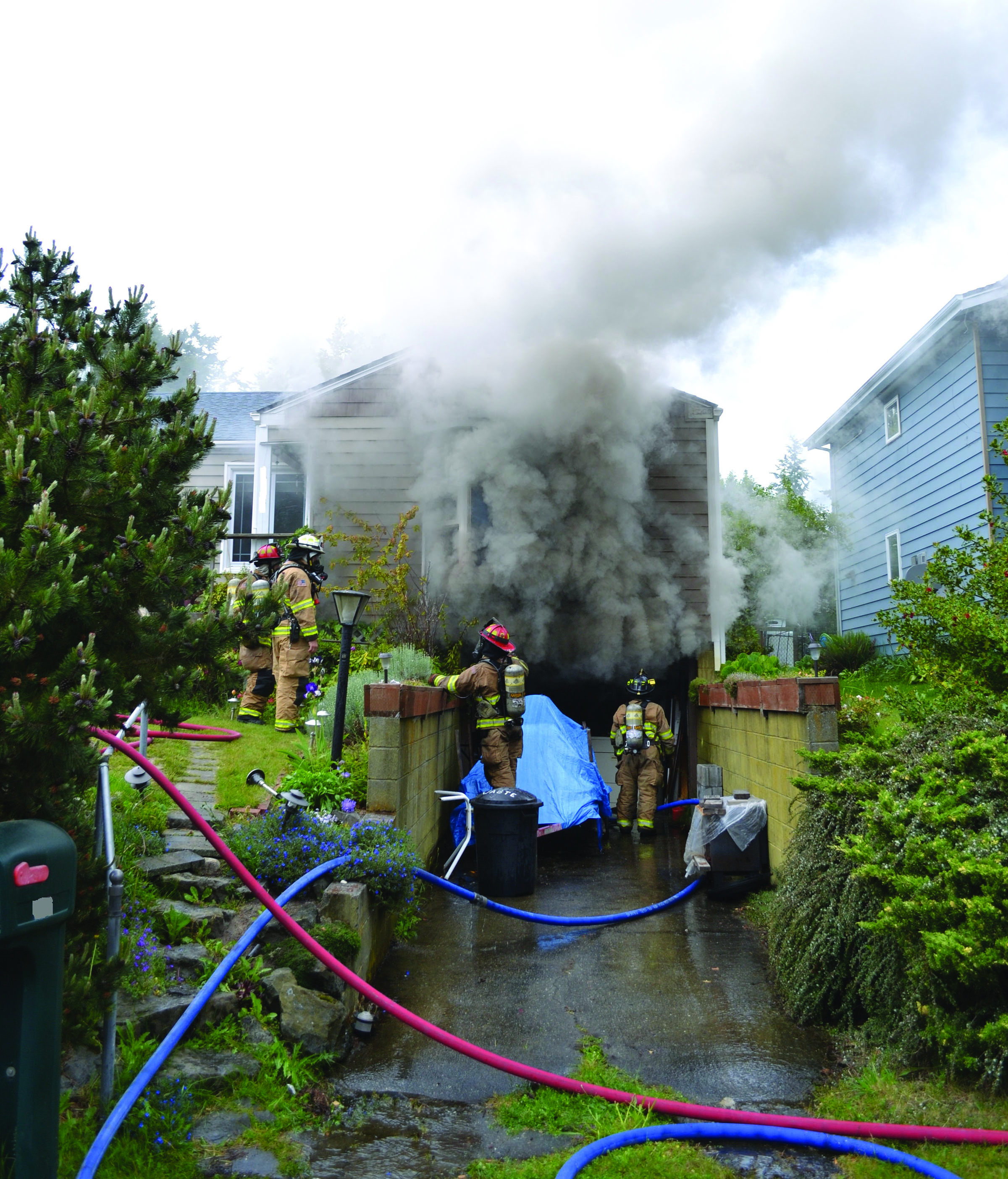 Firefighters work Sunday morning to put out a fire on Taft Street in Port Townsend. (Bill Beezley/East Jefferson Fire-Rescue)