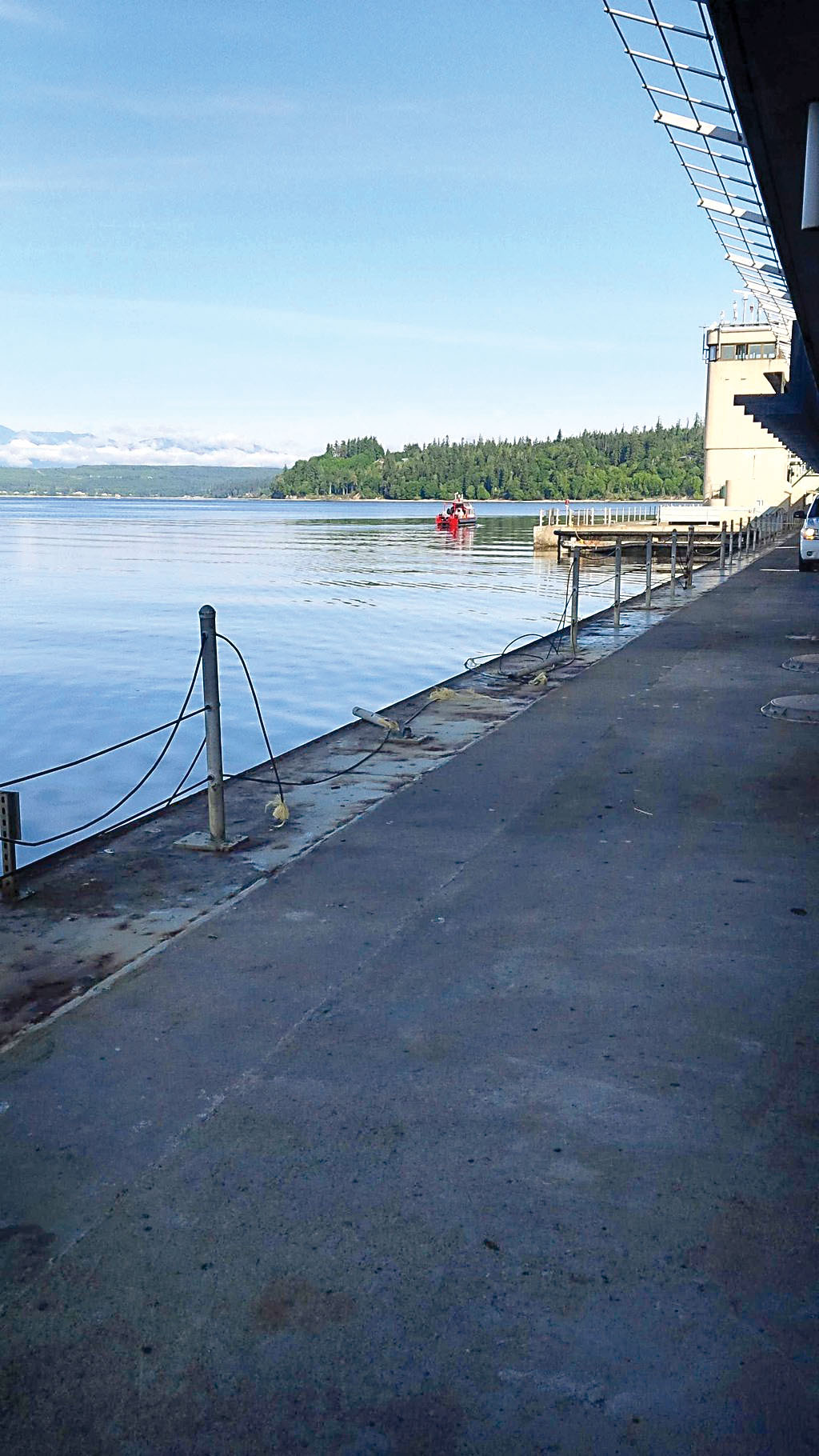 A Department of Transportation bridge maintenance technician’s personal vehicle is believed to have breached a pedestrian cable railing on the lower deck while leaving his work shift Monday. — Trooper Russ Winger/Washington State Patrol ()