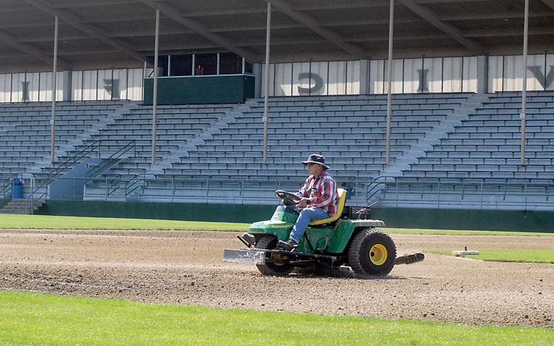 Matt Rosey of the Port Angeles Parks Department grooms the baseball infield at Civic Field on Friday. (Keith Thorpe/Peninsula Daily News)