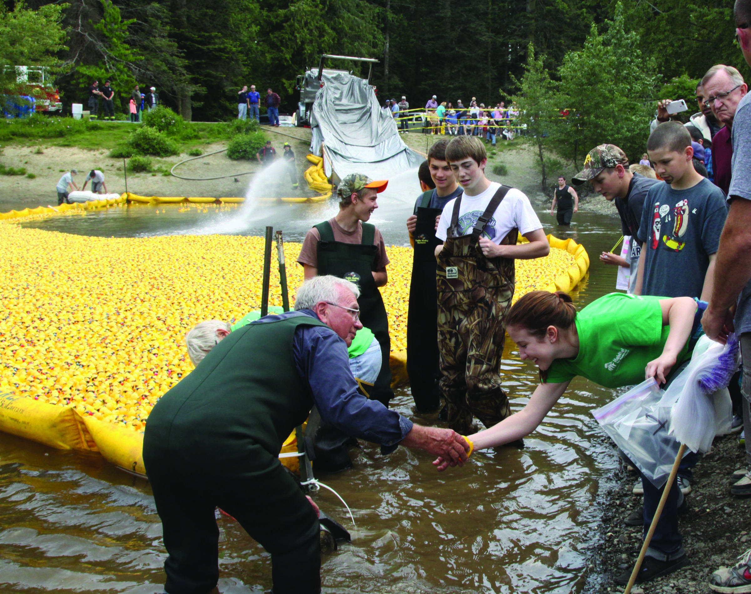 Jerry Hendricks hands off the first-place duck to Naomi Kuykendall of Port Angeles