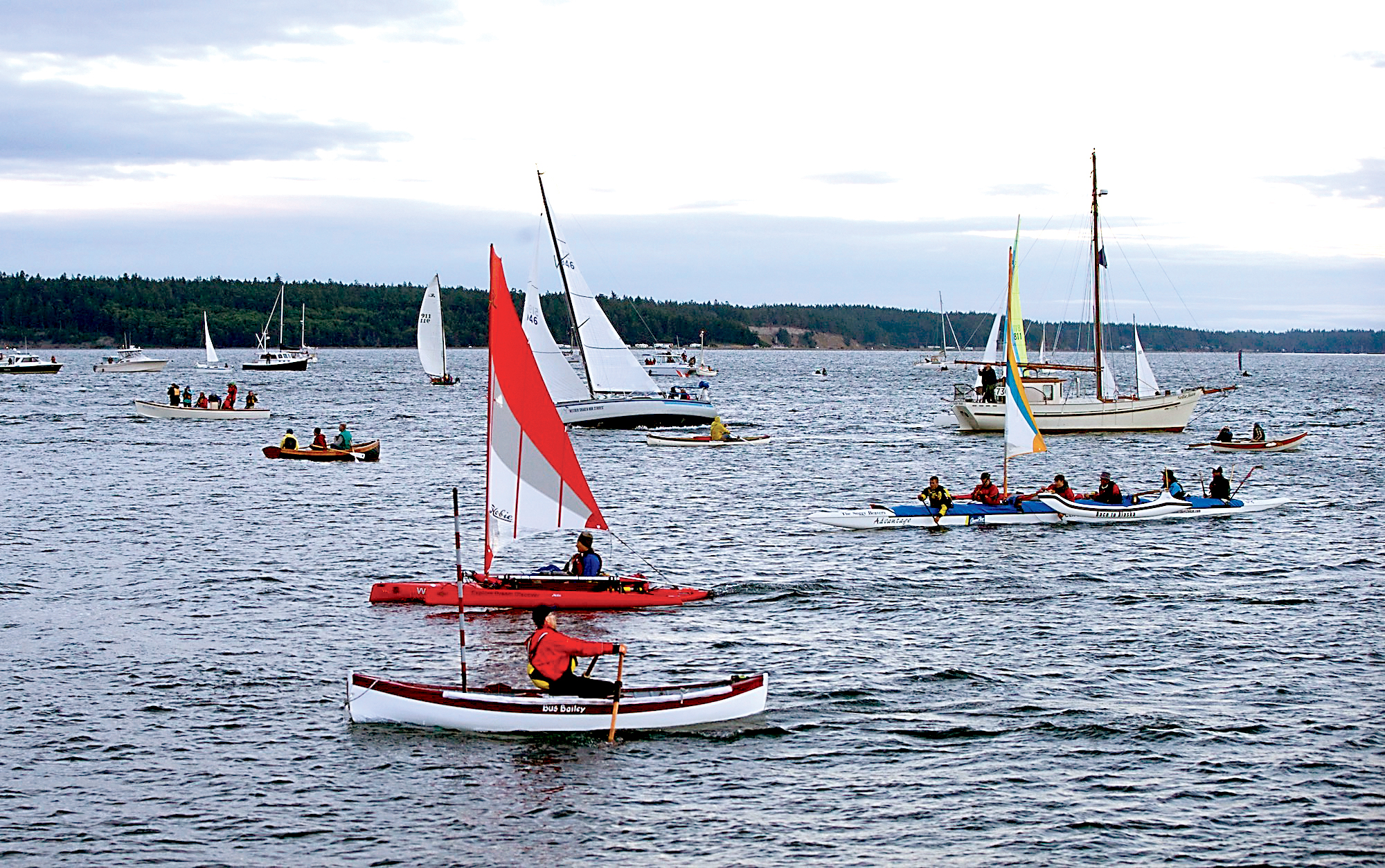 Racers cross the starting line off Port Townsend to begin the Race to Alaska at 5:30 a.m. on Thursday. (Steve Mullensky/for Peninsula Daily News)