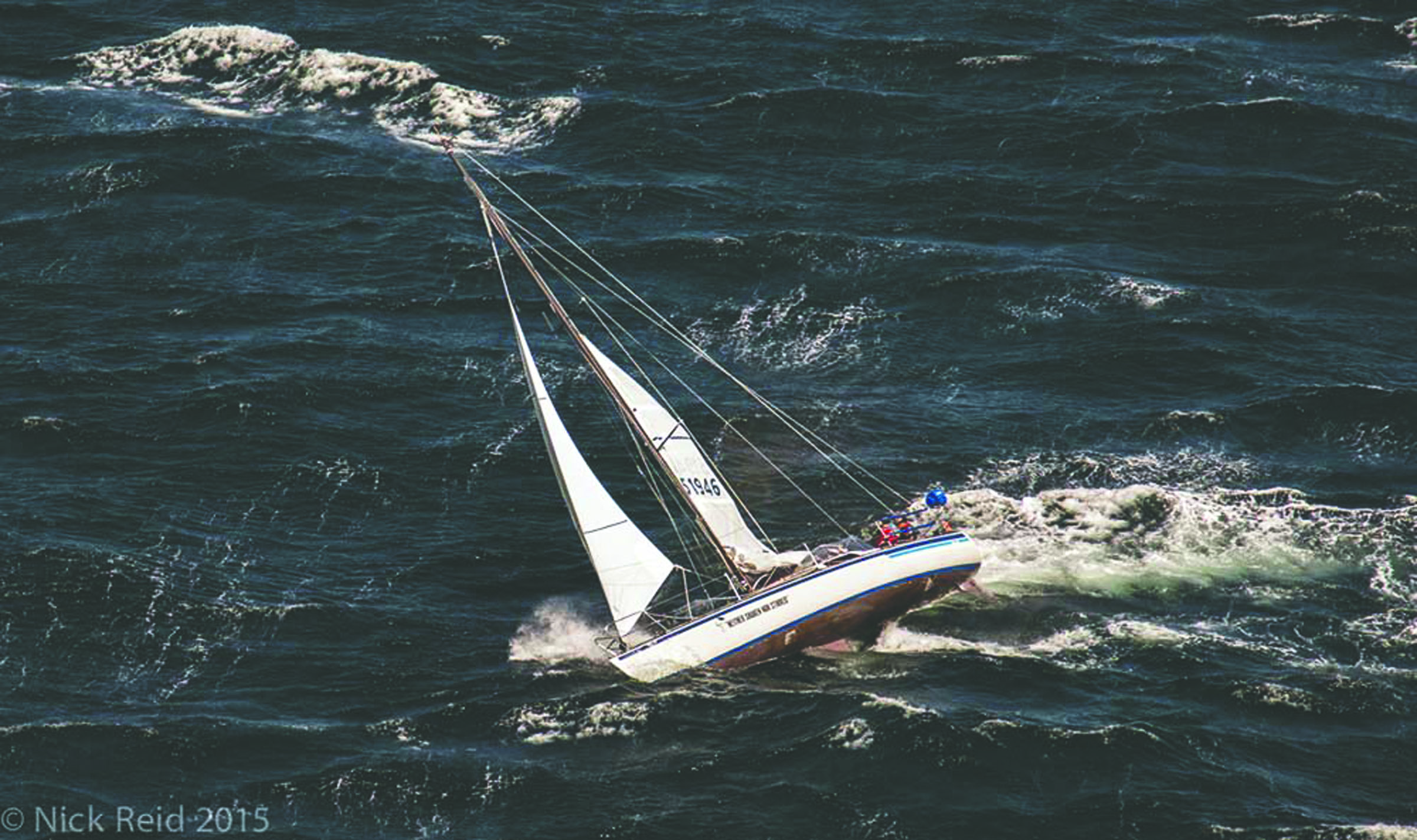 Por Favor races through Johnstone Strait on its way to a third-place win in the Race to Alaska. — Nick Reid ()