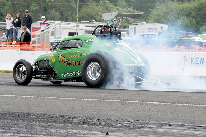 Allan Thornock of Sequim burns rubber en route to the starting line during one of West End Thunder's 2014 car races. (Lonnie Archibald/for Peninsula Daily News)