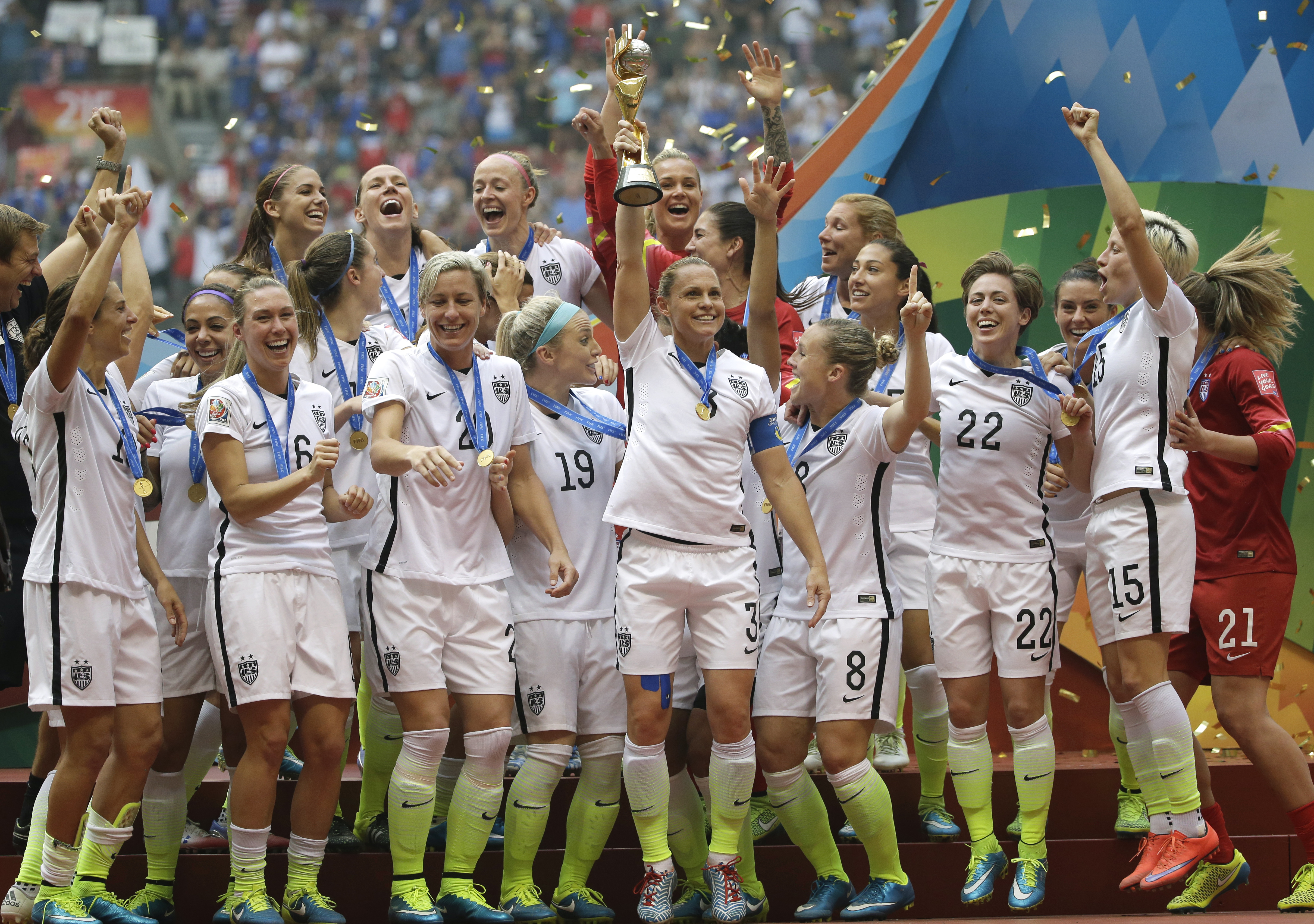 The United States Women's National Team celebrates with the trophy after beating Japan 5-2 in the FIFA Women's World Cup soccer championship on Sunday. Elaine Thompson/The Associated Press