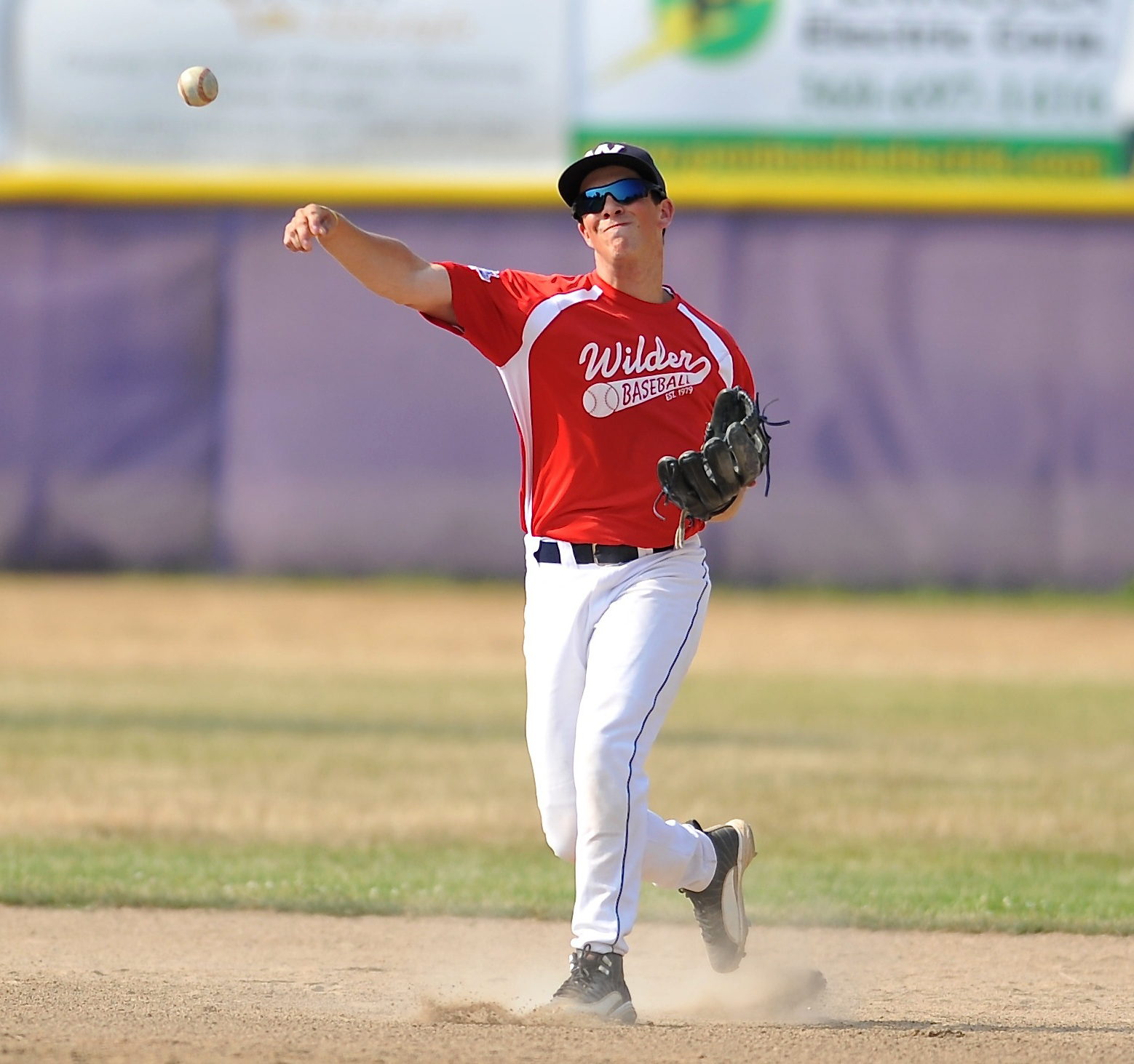 Wilder shortstop Brady Konopaski throws to first base against North Kitsap last week. Jeff Halstead/for Peninsula Daily News