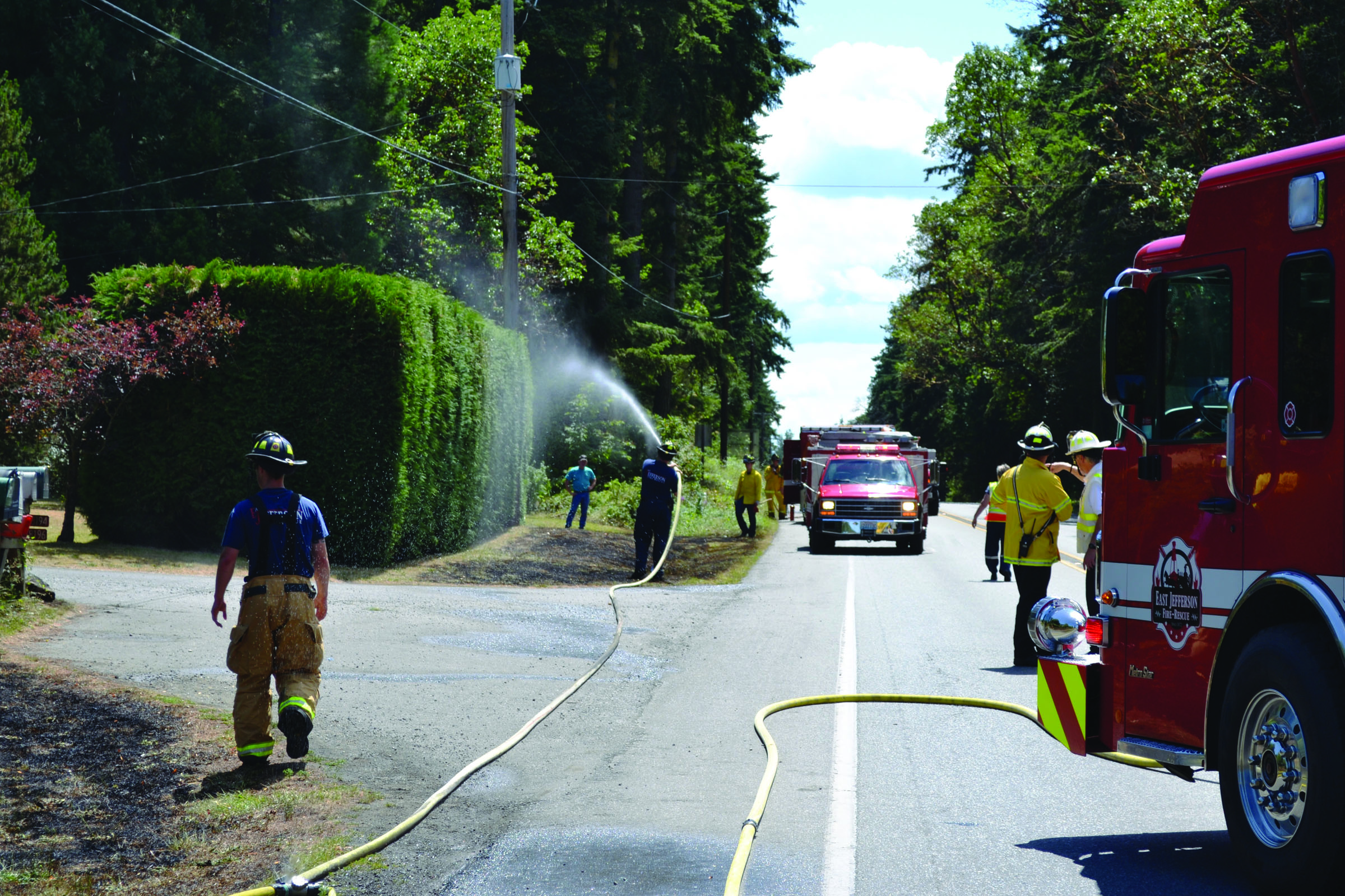 State Highway 20 was blocked for about 50 minutes Thursday afternoon while firefighters from East Jefferson Fire-Rescue and Port Ludlow Fire & Rescue fought five small brush fires by the side of the road. Bill Beezley/East Jefferson Fire-Rescue