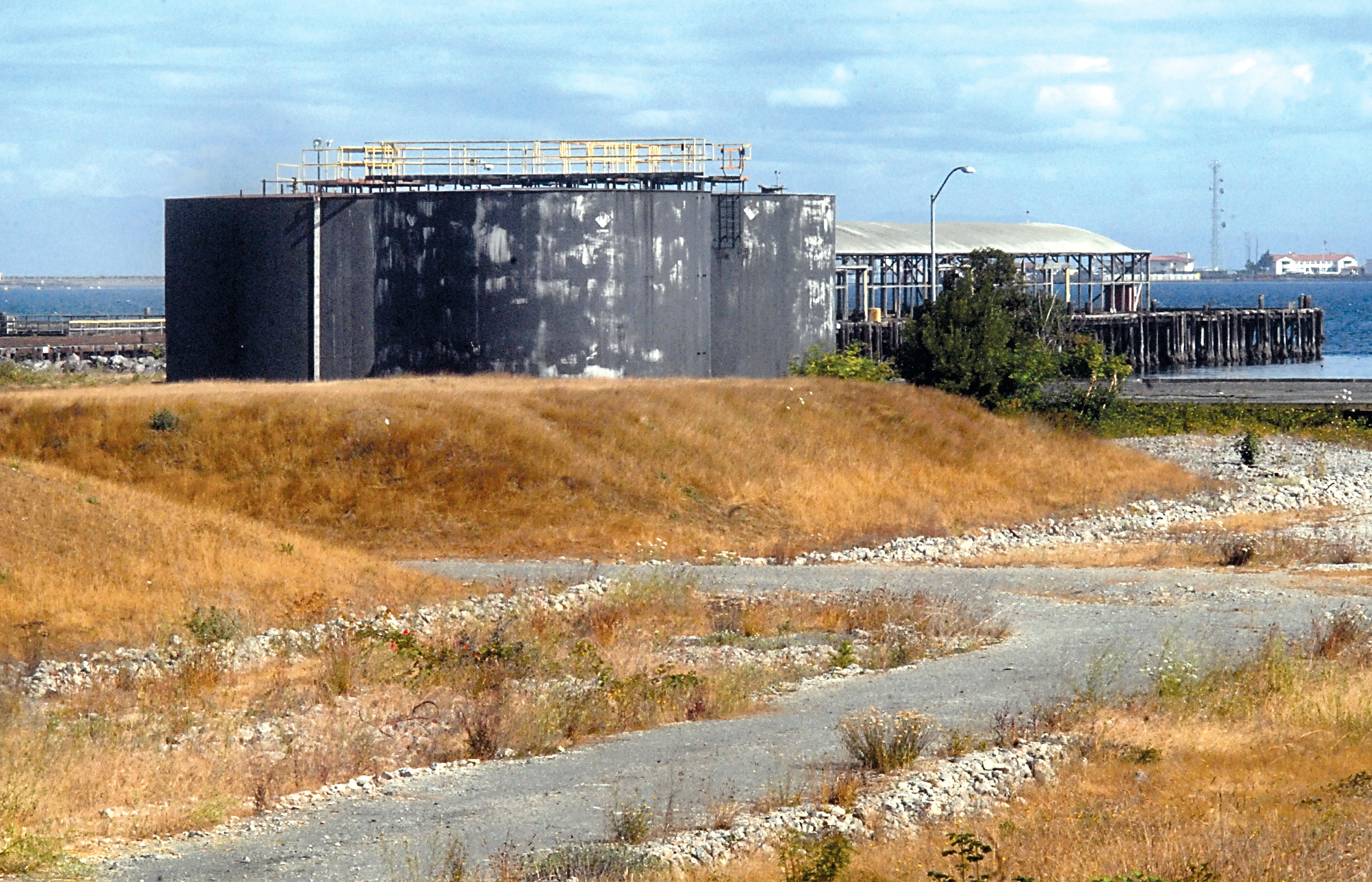 A trio of storage tanks and a loading pier are among the few structures still standing on the site of the former Rayonier pulp mill in Port Angeles. — Keith Thorpe/Peninsula Daily News