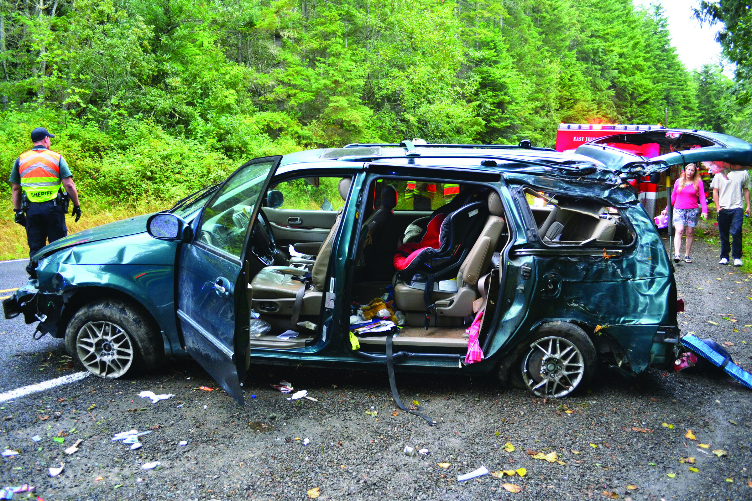 The driver of Kia Sedona minivan avoided injury after she swerved to avoid a bear in the road