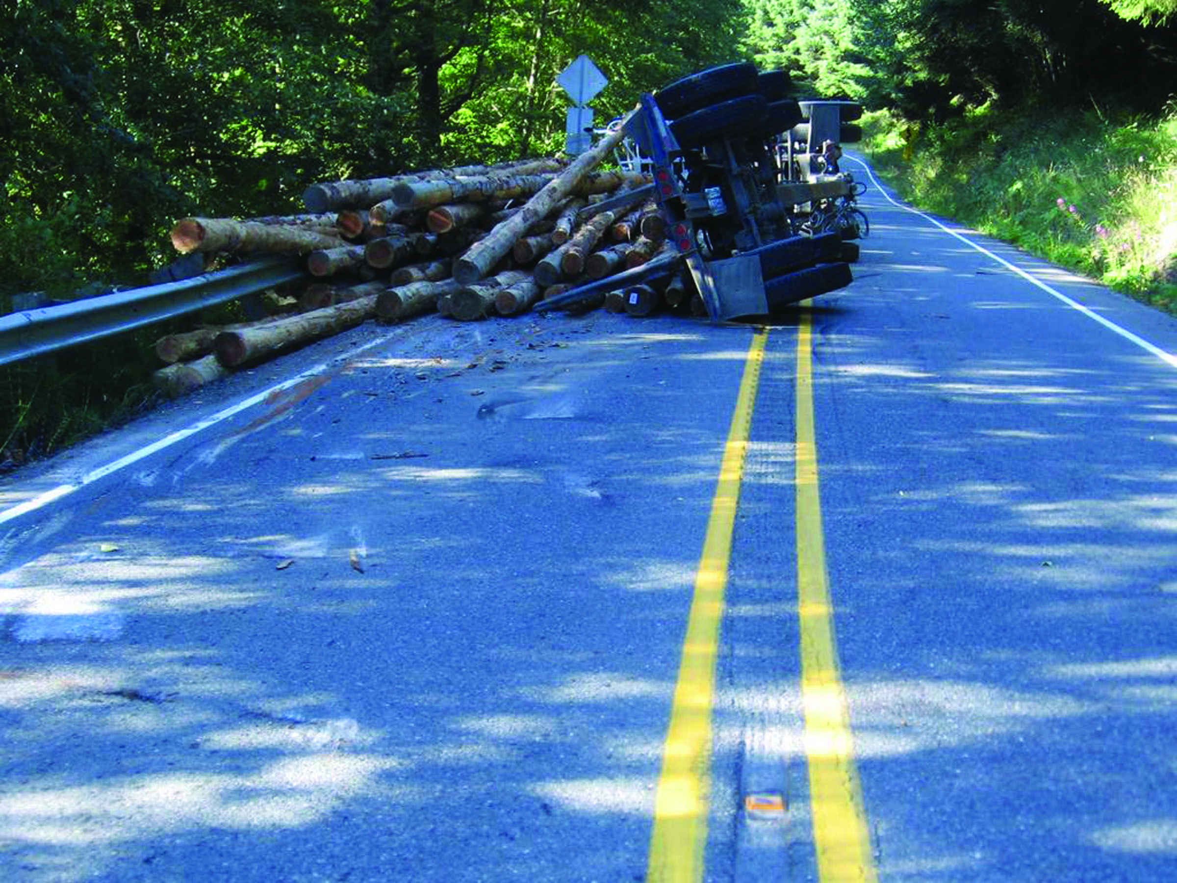 This log truck overturned Monday morning on state Highway 112