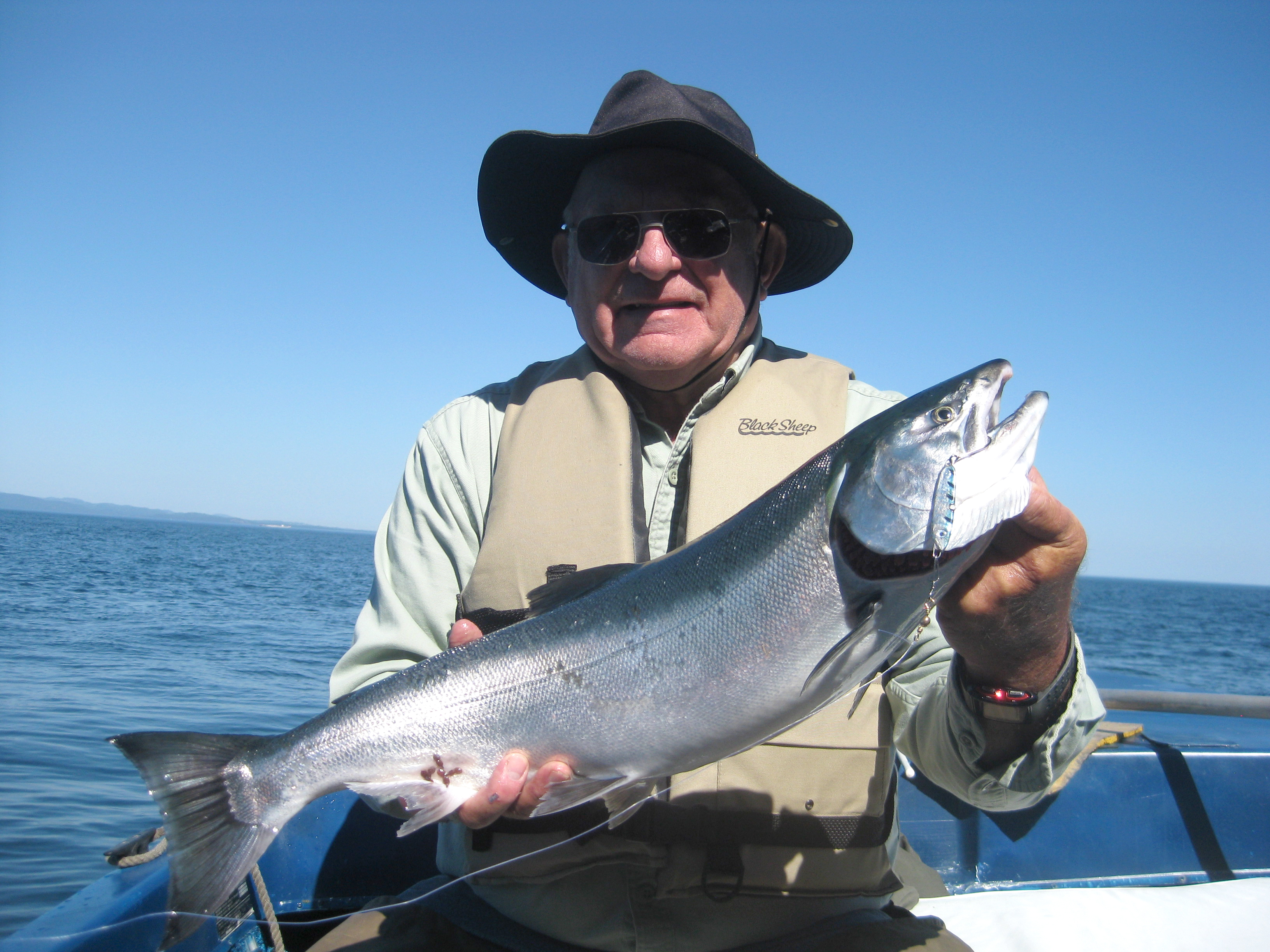 Al Brown of Port Angeles caught this 9-pound coho on his first cast last Friday at Pineapple Rock near Freshwater Bay. Brown used a one-third ounce blue-silver Sonic BaitFish lure. Pete Rosko