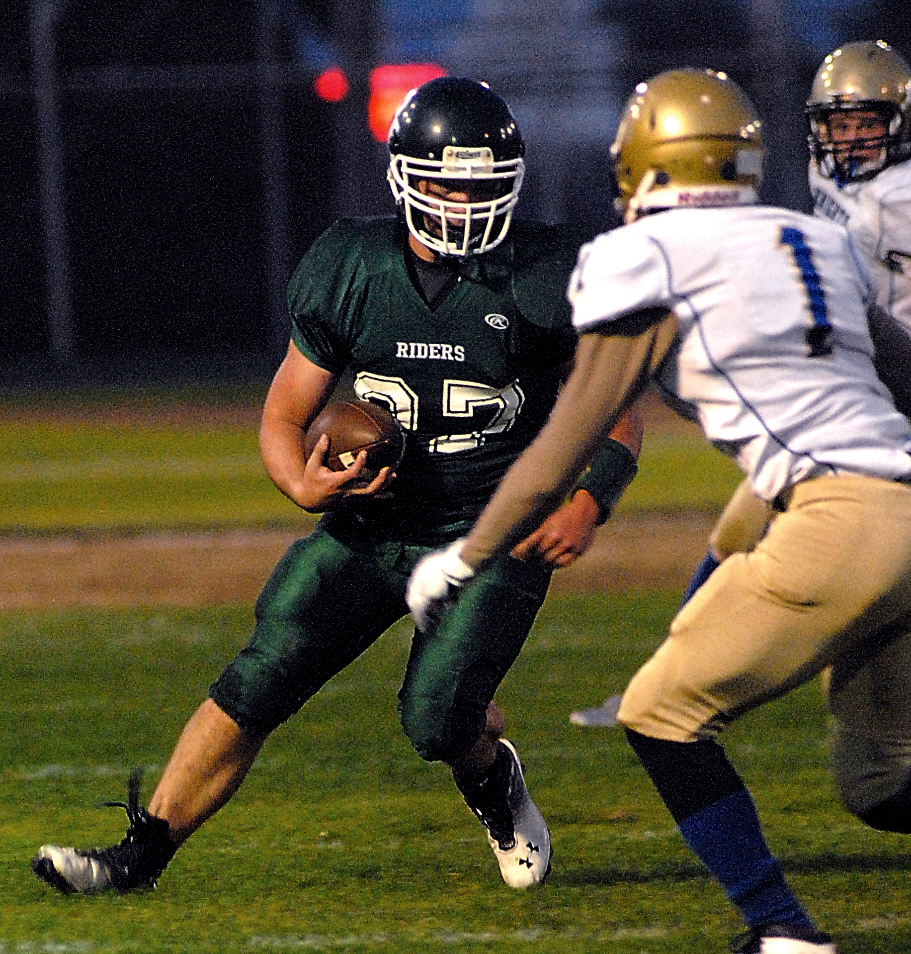 Port Angeles' Jace Lausche looks for a way around Bremerton's Tony Watson during the second quarter of the Roughriders' 23-7 loss at Civic Field. Keith Thorpe/Peninsula Daily News