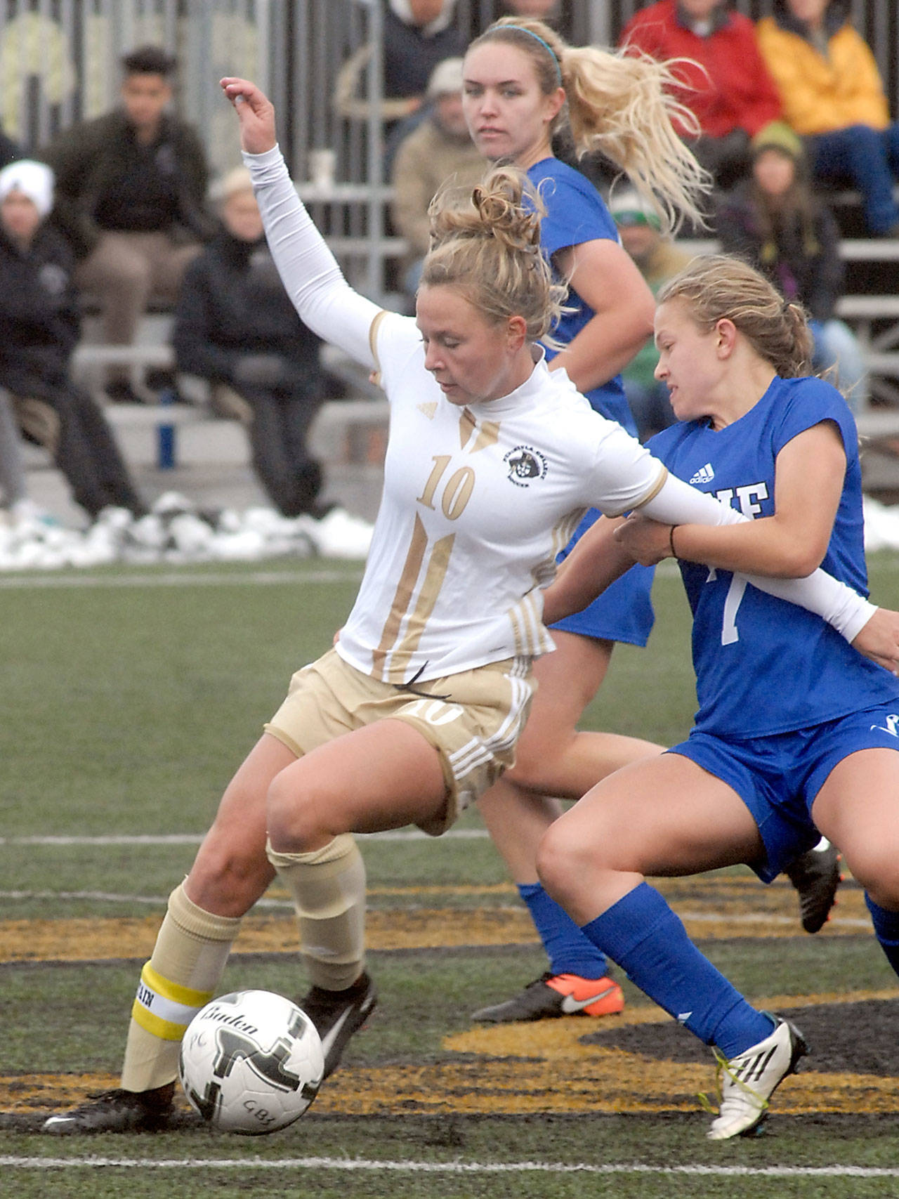 Keith Thorpe/Peninsula Daily News Peninsula’s Kelly Kevershan, front, fends off Lane’s Kyla Ganchan Romero, right, and Gwyn Anderson during Saturday’s NWAC quarterfinal playoff game at the Wally Sigmar Sports Complex in Port Angeles.