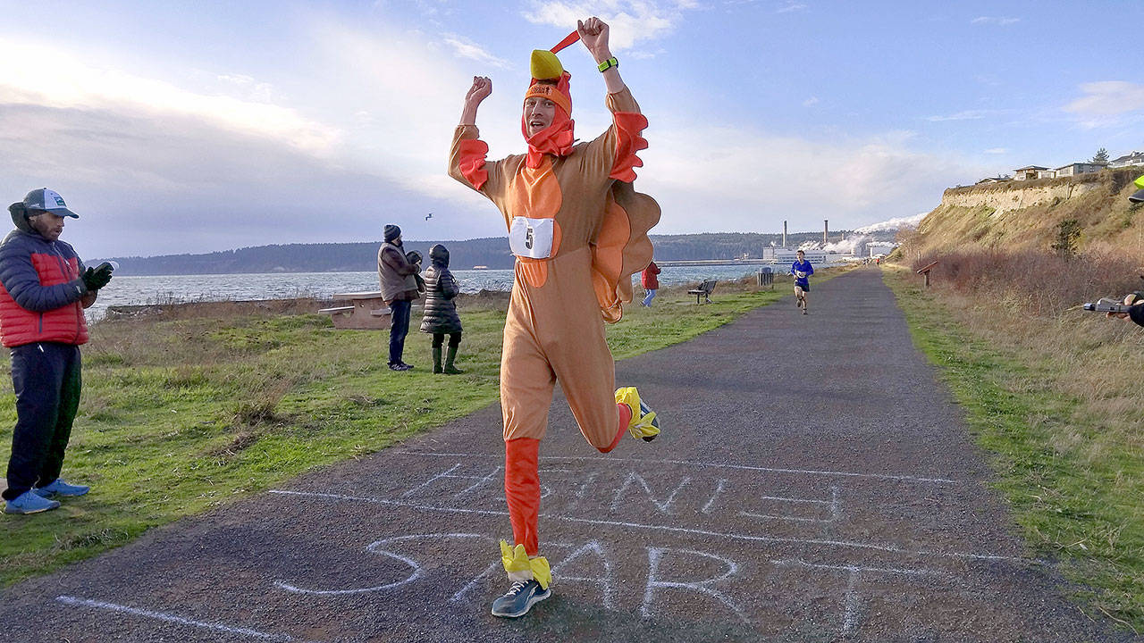 Adam Carter of Port Townsend completes the race at the 2016 Turkey Trot 5K in Port Townsend. (Candy Carte)