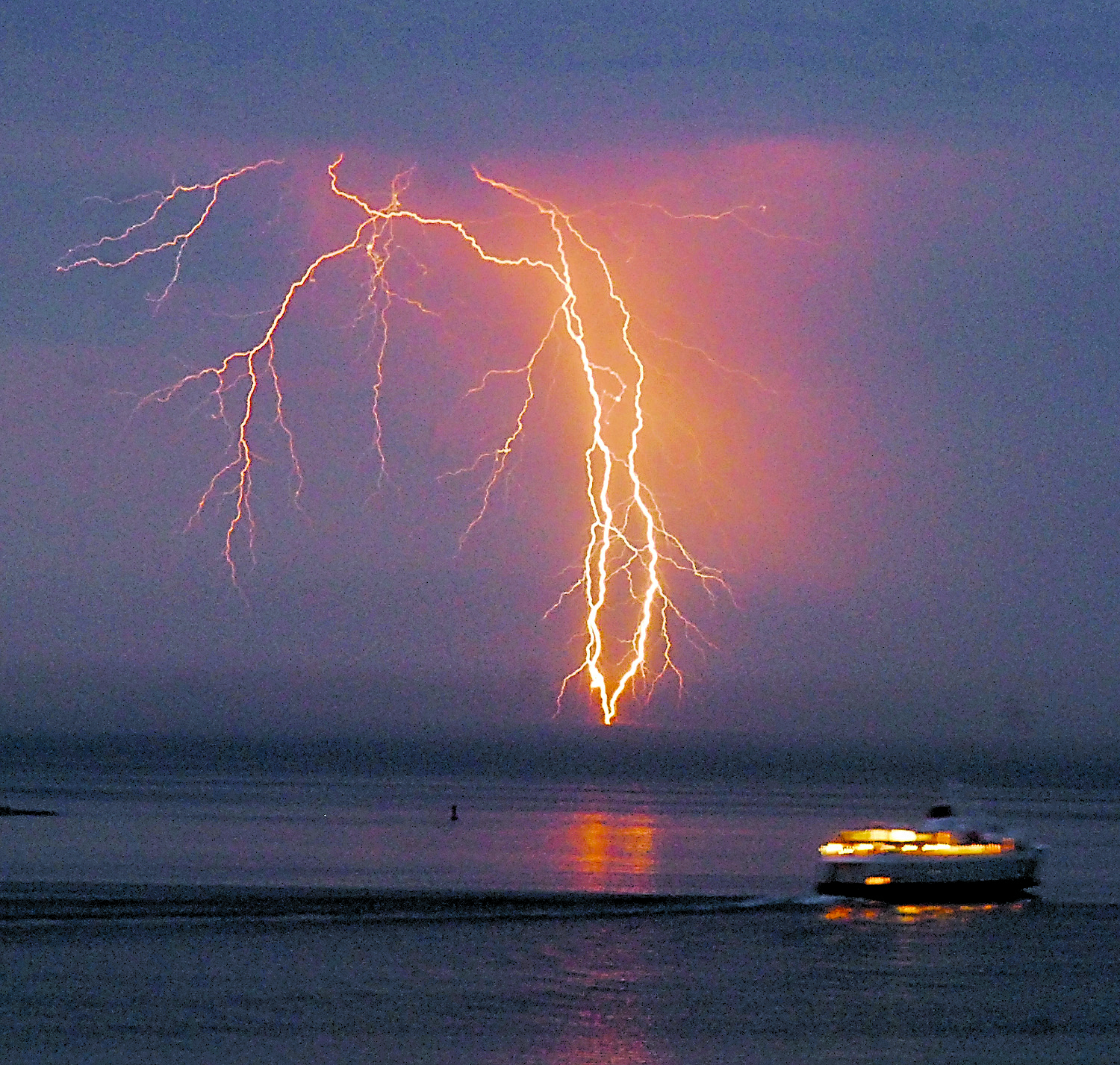 Lightning crashes down over the Strait of Juan de Fuca as the ferry MV Coho