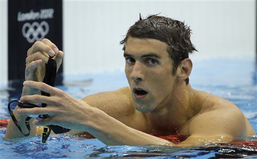 Michael Phelps reacts after winning silver in the men's 200-meter butterfly swimming final at the Aquatics Centre in the Olympic Park in London. The Associated Press