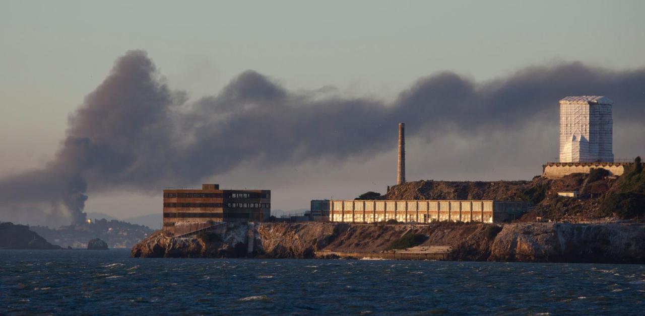 Smoke pours from the fire at the Chevron Richmond Refinery