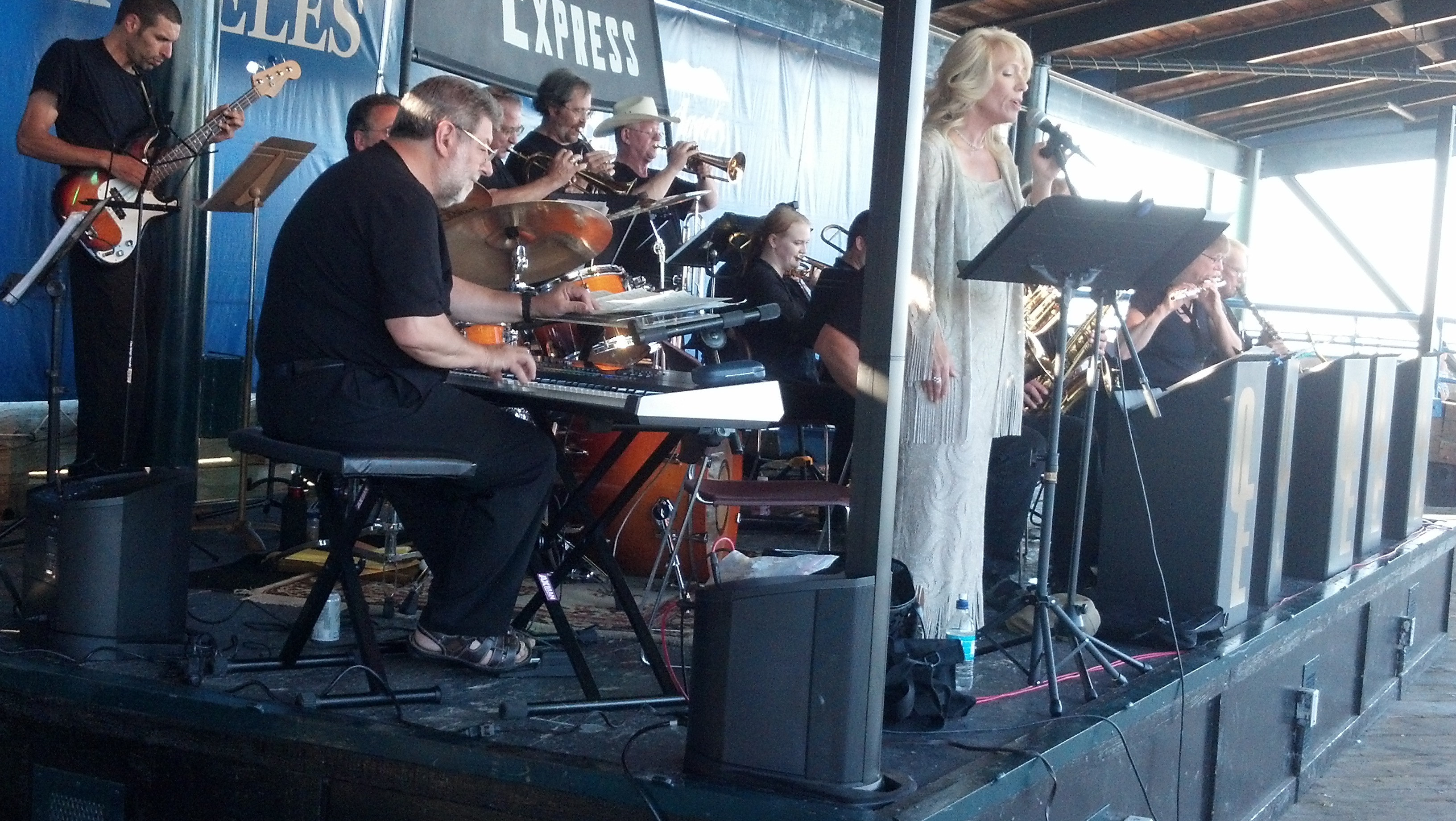 Teresa Pierce and Olympic Express on the pier. Peninsula Daily News (click to enlarge)