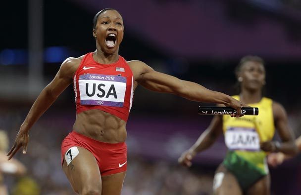 Carmelita Jeter reacts as she crosses the finish line to win the women's 4x100-meter relay. The Associated PRess