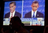 John Rossitto watches the first presidential debate between President Barack Obama and Republican presidential nominee Mitt Romney from a restaurant in San Diego. The Associated Press