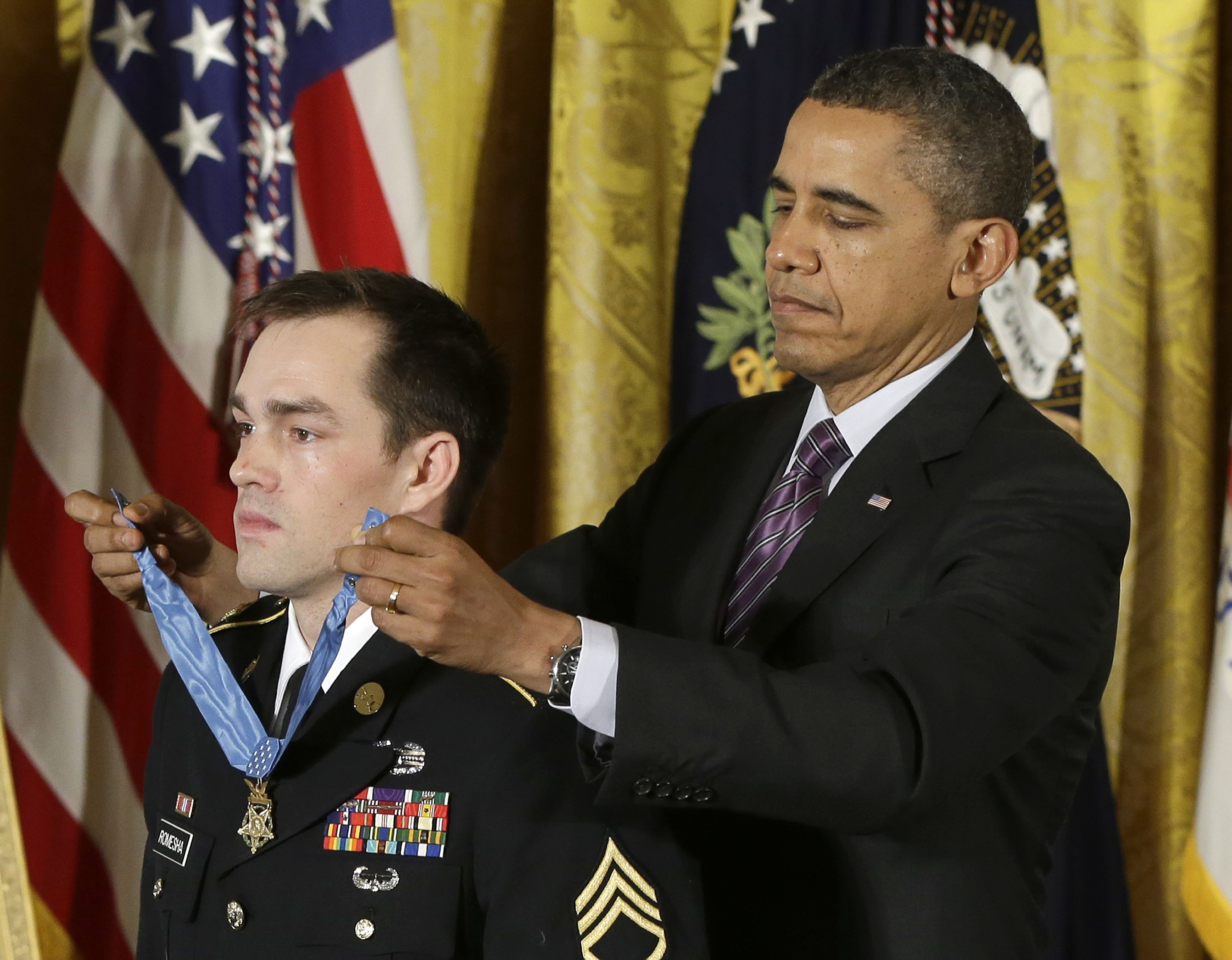 President Obama presents former Army Staff Sgt. Clinton Romesha with the Medal of Honor. The Associated Press