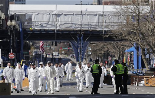 Police and investigators scour Boylston Street