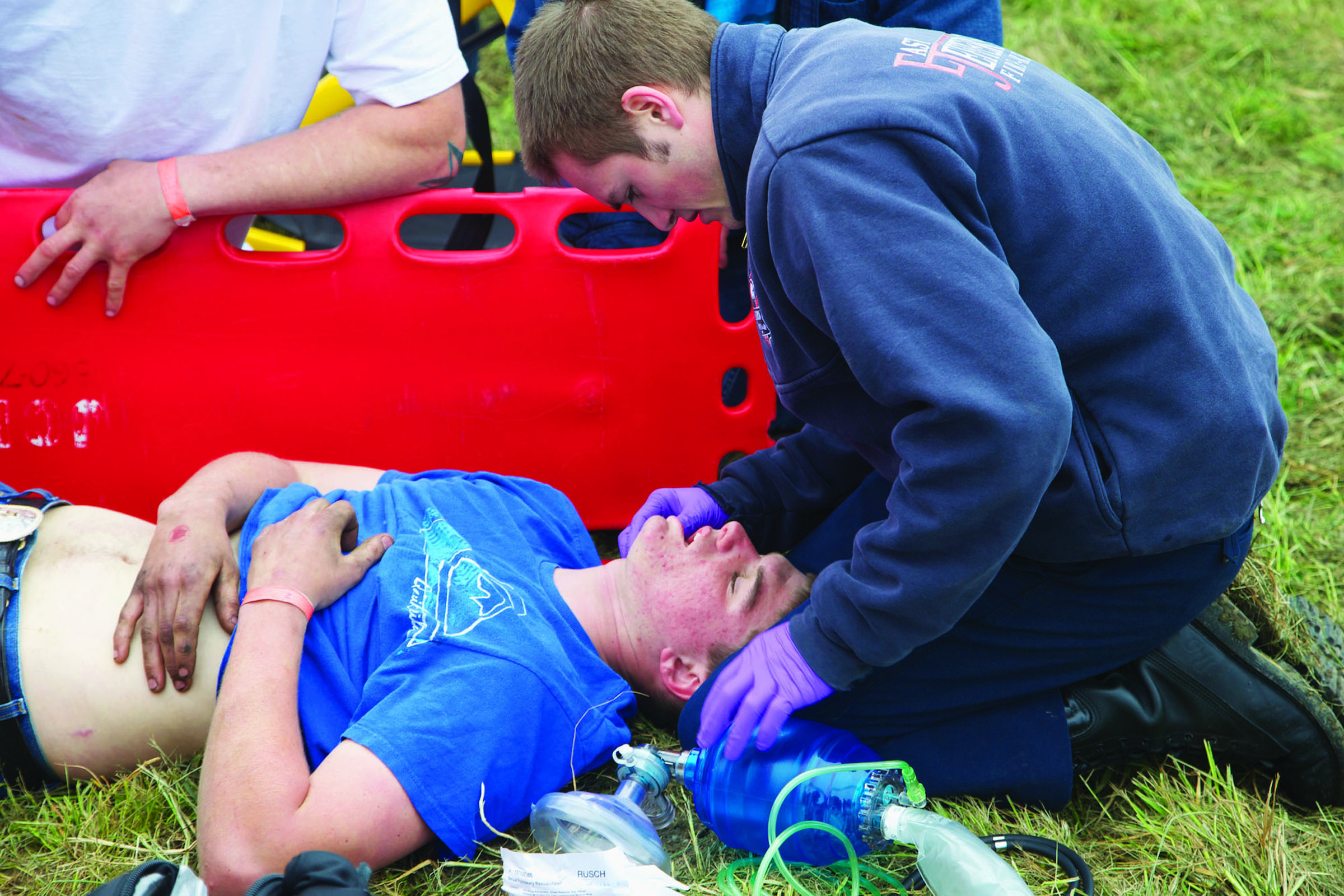 Austin Bishop is attended by an East Jefferson Fire-Rescue emergency medical technician. Steve Mullensky/For Peninsula Daily News