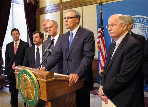 Gov. Jay Inslee is joined by legislative leaders from the House and Senate as he announces a budget deal Thursday. Now that the Legislature has passed the budget