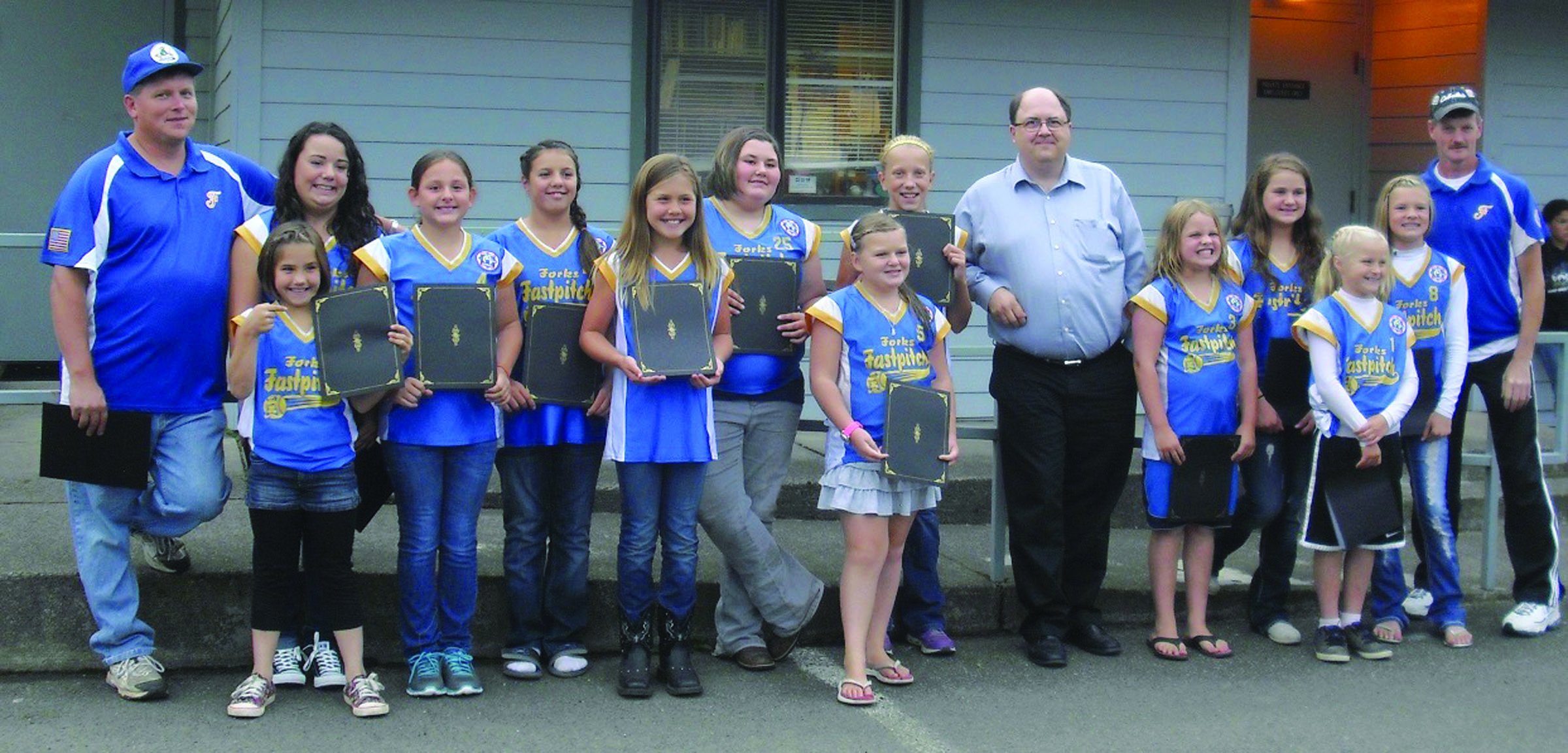 The Forks 10U softball team received proclamations honoring its state and regional titles from Forks Mayor Bryon Monohon at Monday's City Council meeting. Pictured are