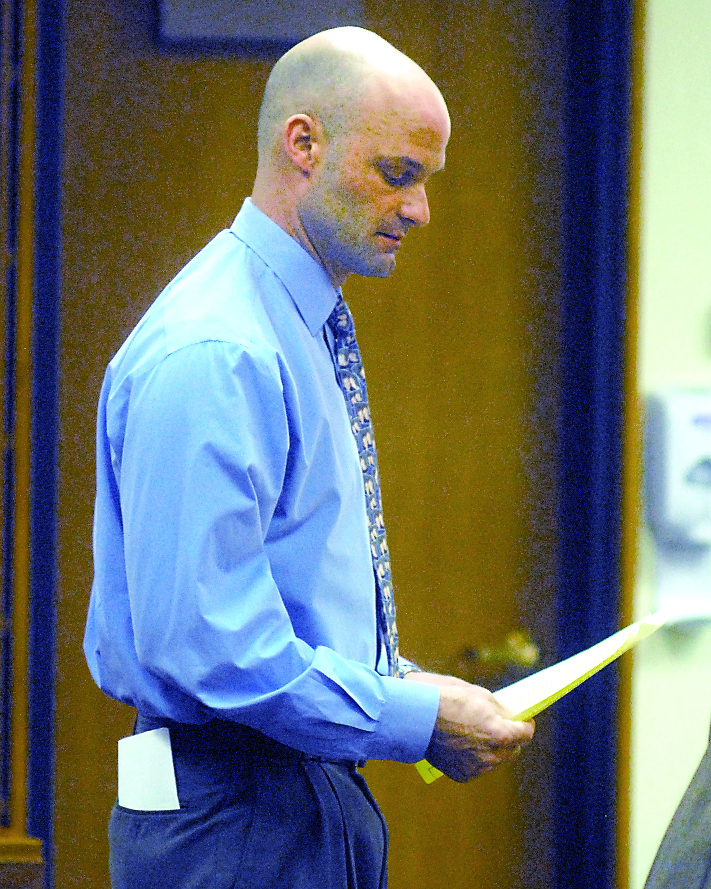 Former Clallam County Fire District 3 employee Paul Rynearson looks over paperwork during his December appearance in Clallam County Superior Court in Port Angeles. Keith Thorpe/Peninsula Daily News